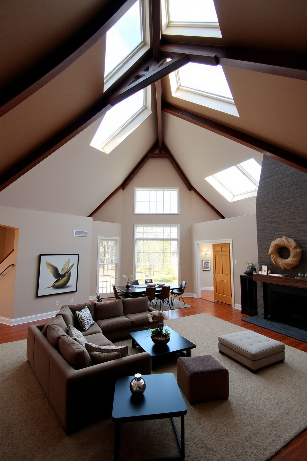 A spacious living room with vaulted ceilings that create a sense of dramatic height. The ceiling features exposed wooden beams and large skylights that fill the space with natural light. The walls are painted in a soft neutral tone, complementing the rich textures of the furniture. A plush sectional sofa is positioned around a modern coffee table, creating an inviting seating area.