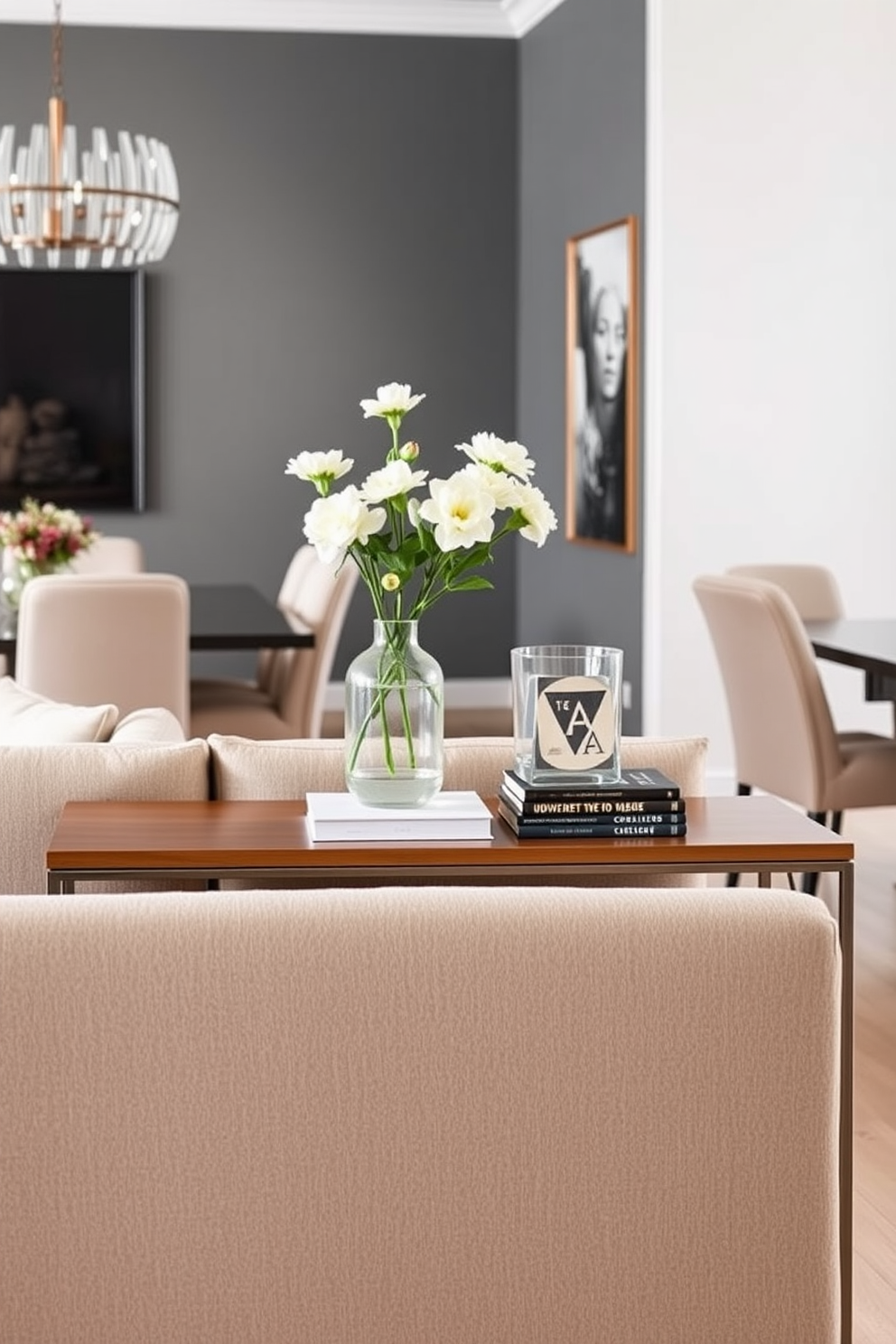 A contemporary living room and dining room combo featuring geometric patterns throughout the space. The walls are adorned with bold geometric wallpaper in contrasting colors, while the furniture includes a sleek sectional sofa and a modern dining table with angular lines. Accent pillows with geometric designs are scattered across the sofa, adding texture and visual interest. A statement light fixture with geometric shapes hangs above the dining table, creating a focal point in the room.