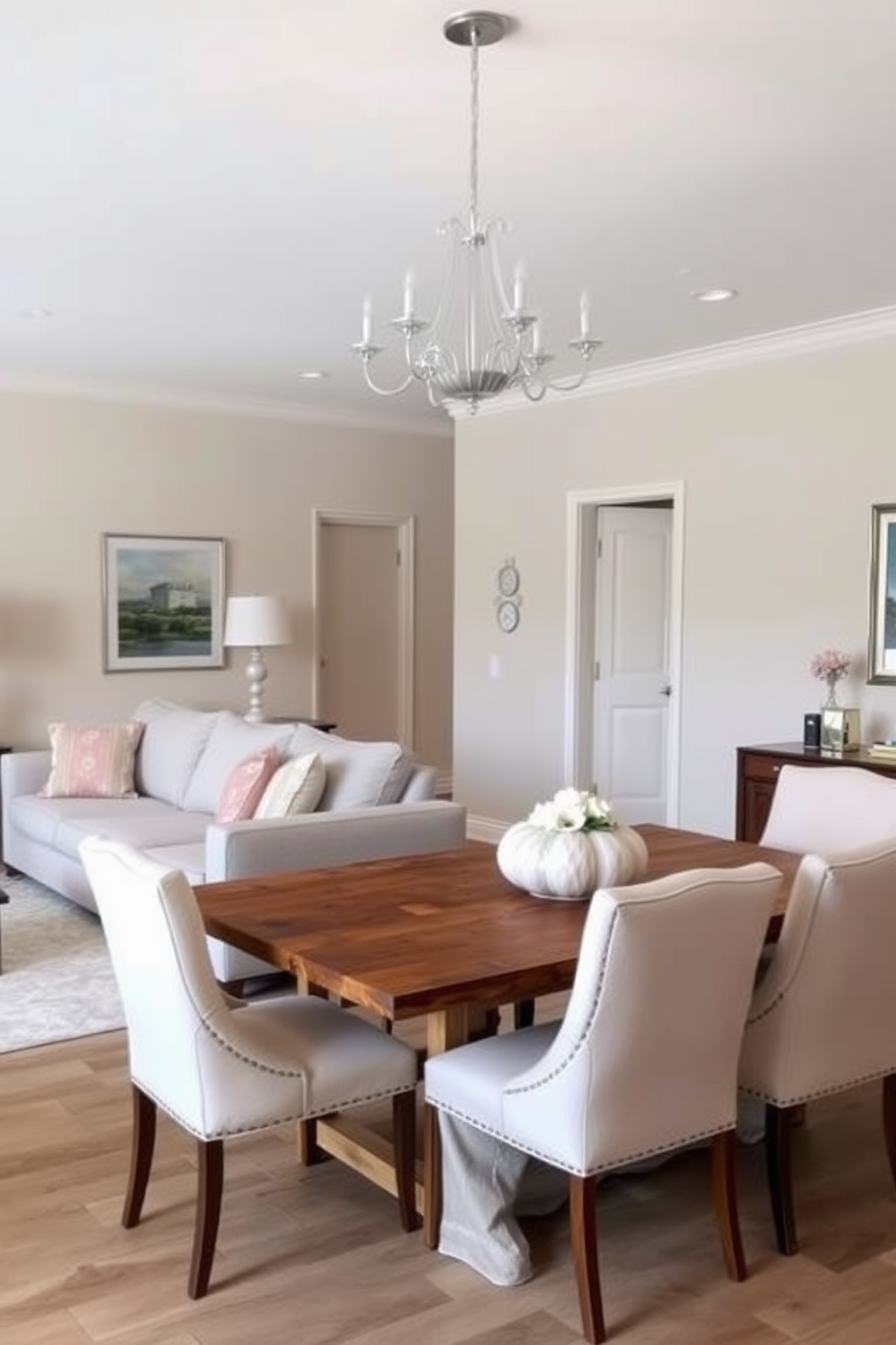 A cozy living room and dining room combo featuring area rugs to define each space. The living area showcases a plush, textured rug in warm tones, while the dining space boasts a vibrant patterned rug that adds character.