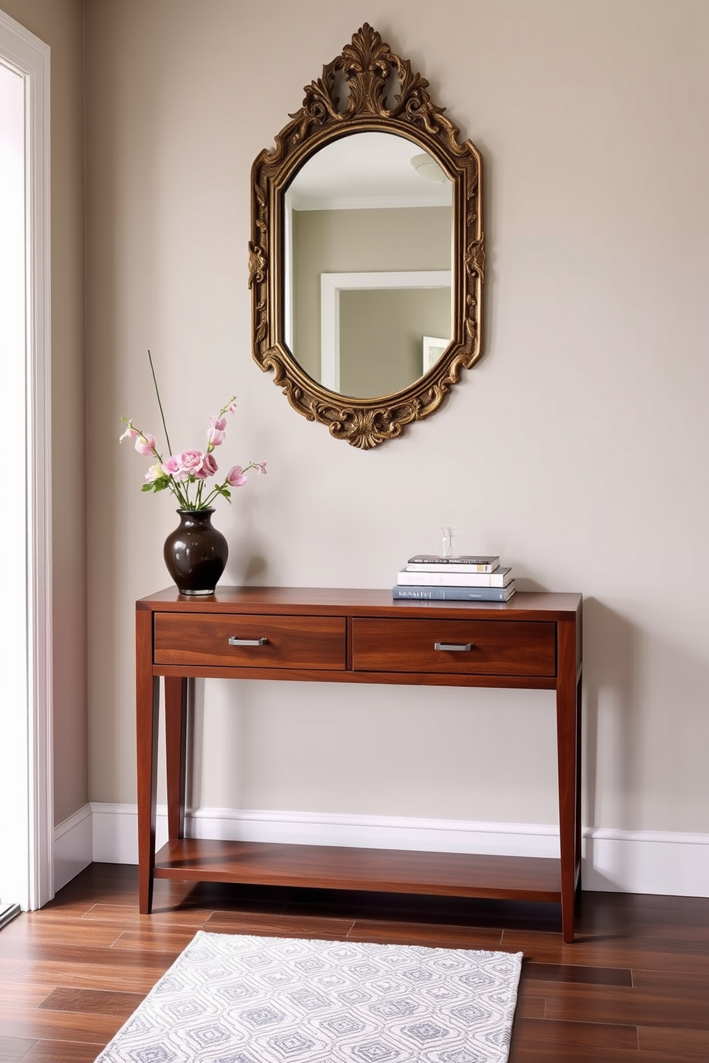 A stylish console table is positioned against the wall, featuring a sleek design in a rich wood finish. Above the table, a decorative mirror with an ornate frame reflects the light, adding depth and elegance to the entryway. The console table is adorned with a few carefully selected decorative items such as a vase with fresh flowers and a stack of art books. The entryway is painted in a soft neutral tone, complemented by a chic runner rug that adds warmth and texture to the space.