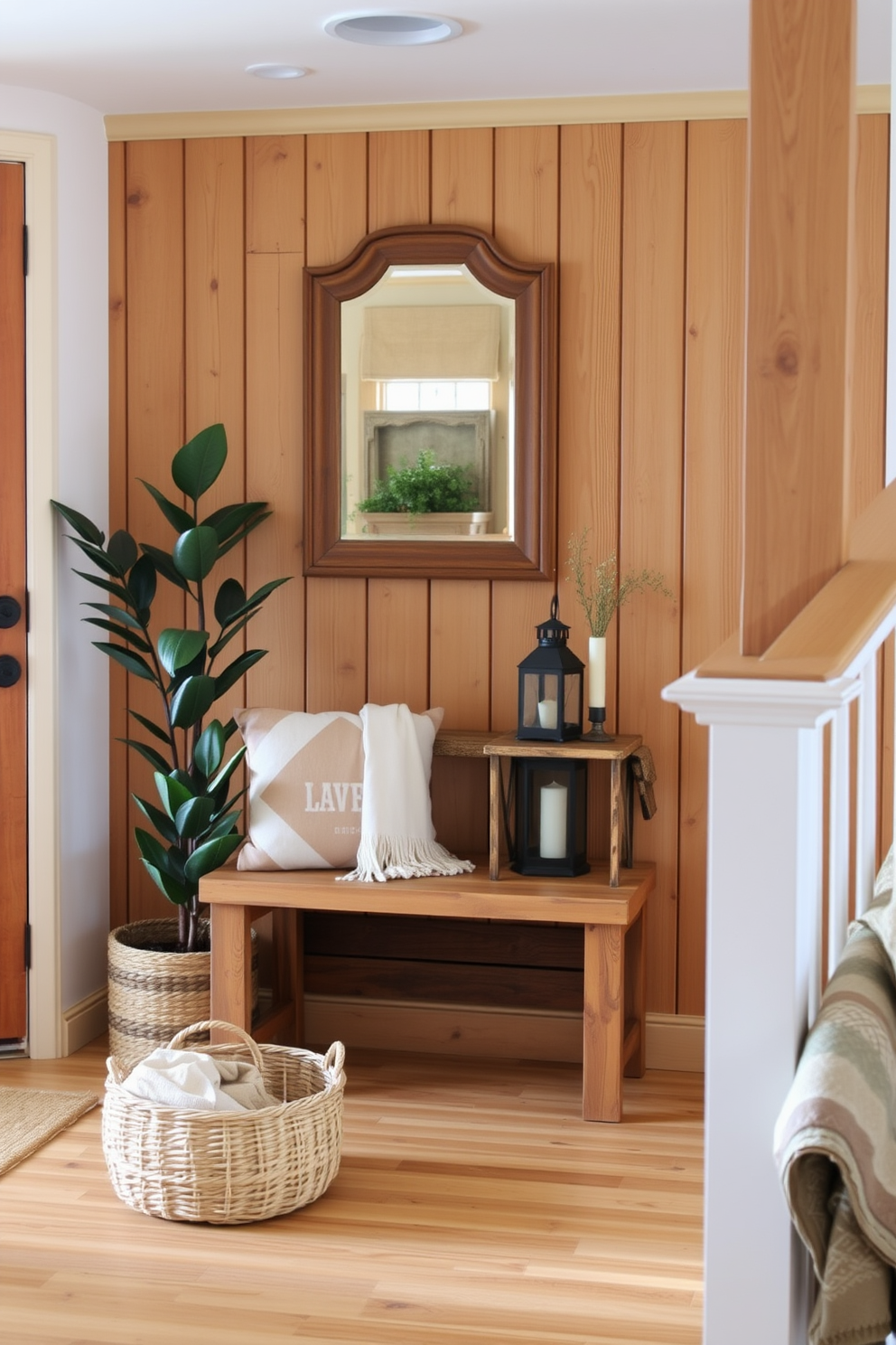 A cozy living room entryway features natural wood elements that evoke a rustic charm. A reclaimed wood bench sits against the wall, complemented by a woven basket filled with blankets and a large potted plant in the corner. The walls are adorned with wooden paneling, creating a warm and inviting atmosphere. A vintage-style mirror with a wooden frame hangs above a small console table, which is decorated with candles and a rustic lantern.