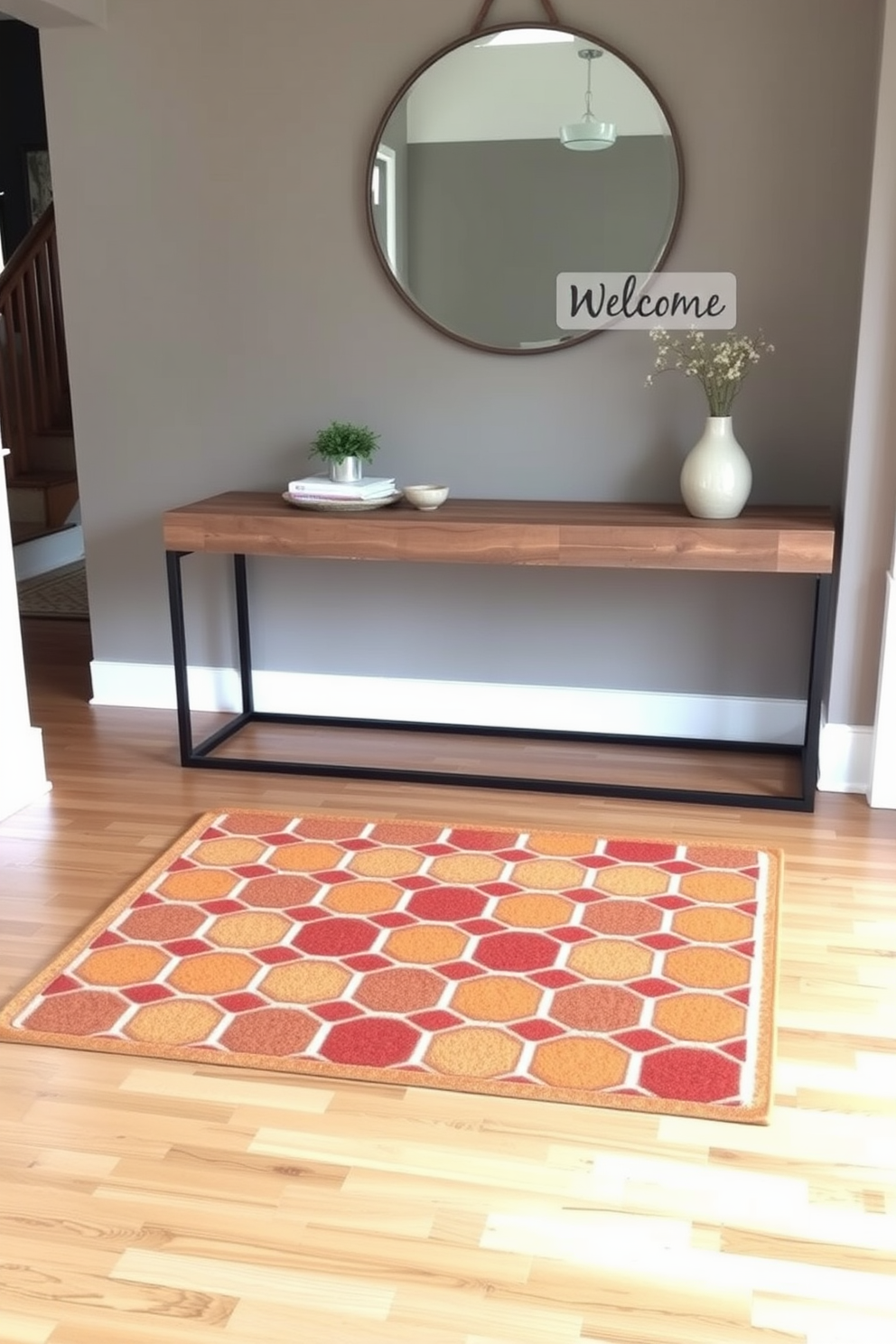 A welcoming entry mat features a geometric pattern in warm earth tones, inviting guests into the space. The mat is placed on a polished hardwood floor, creating a cozy and stylish first impression. The living room entryway showcases a blend of modern and rustic elements, with a sleek console table made of reclaimed wood. Above the table, a large round mirror reflects natural light, enhancing the warmth of the area.