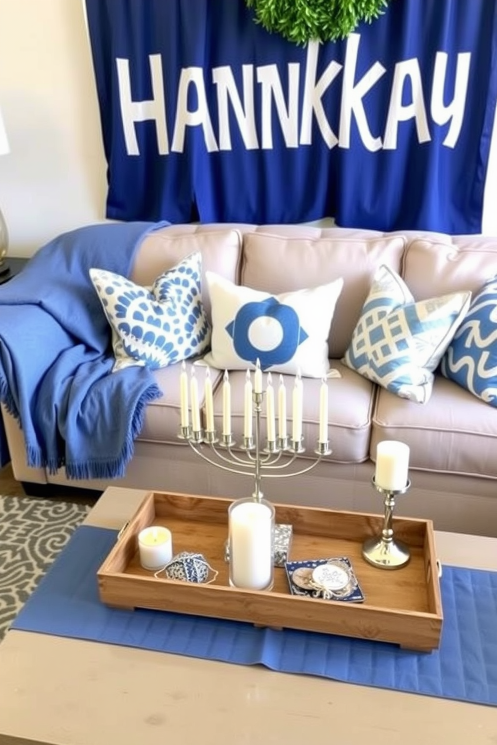 A cozy living room adorned for Hanukkah features a plush sofa draped with blue and white throw pillows that add a festive touch. A beautifully arranged menorah sits on the coffee table, complemented by decorative candles and a soft blue table runner.