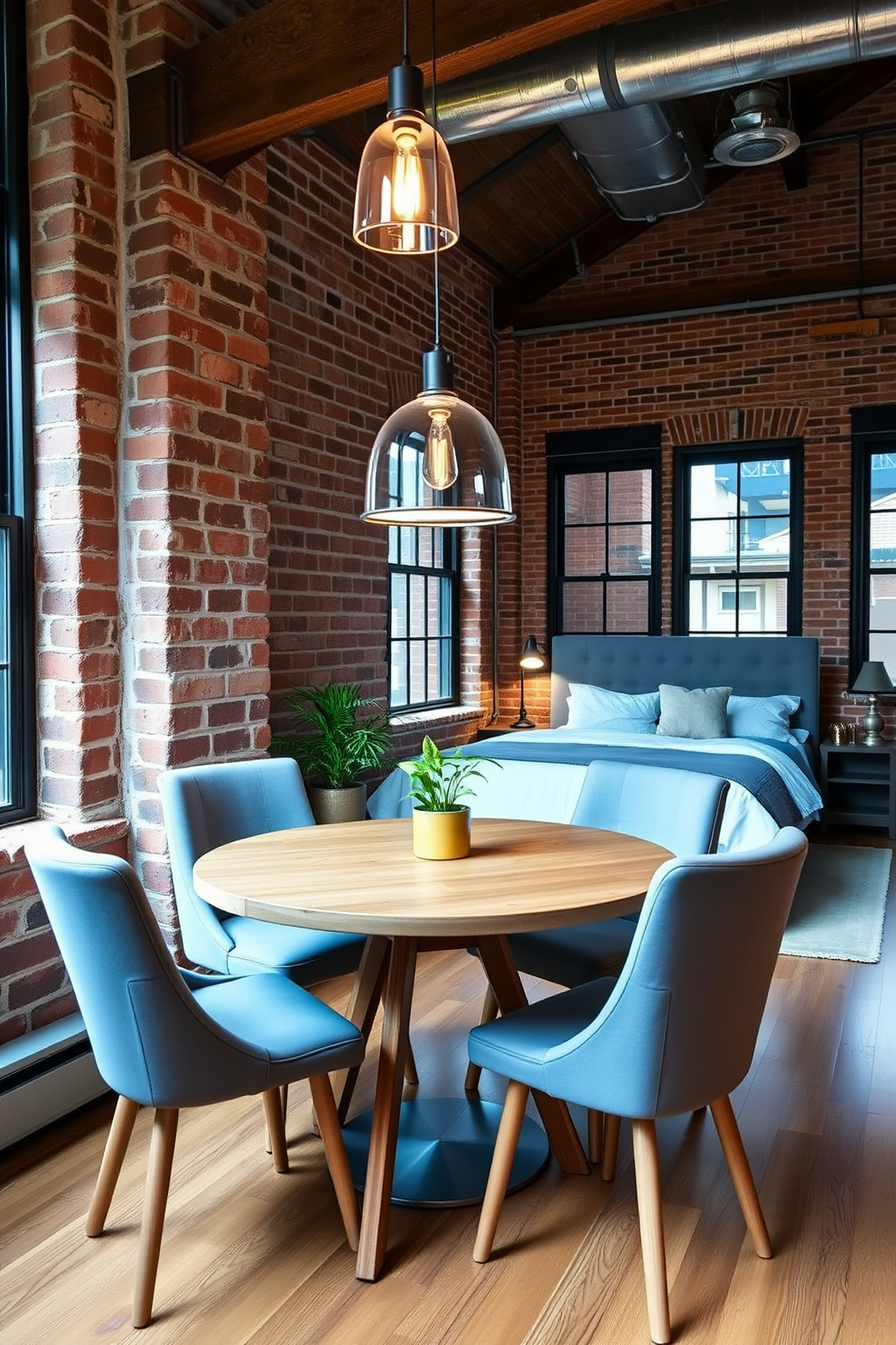 A cozy small dining area features a round wooden table surrounded by four upholstered chairs in soft gray. A pendant light hangs above the table, casting a warm glow, while a small potted plant adds a touch of greenery to the corner. The loft bedroom showcases an industrial aesthetic with exposed brick walls and large windows. A king-sized bed with a plush headboard is positioned against the wall, complemented by a stylish bedside table and a vintage lamp.