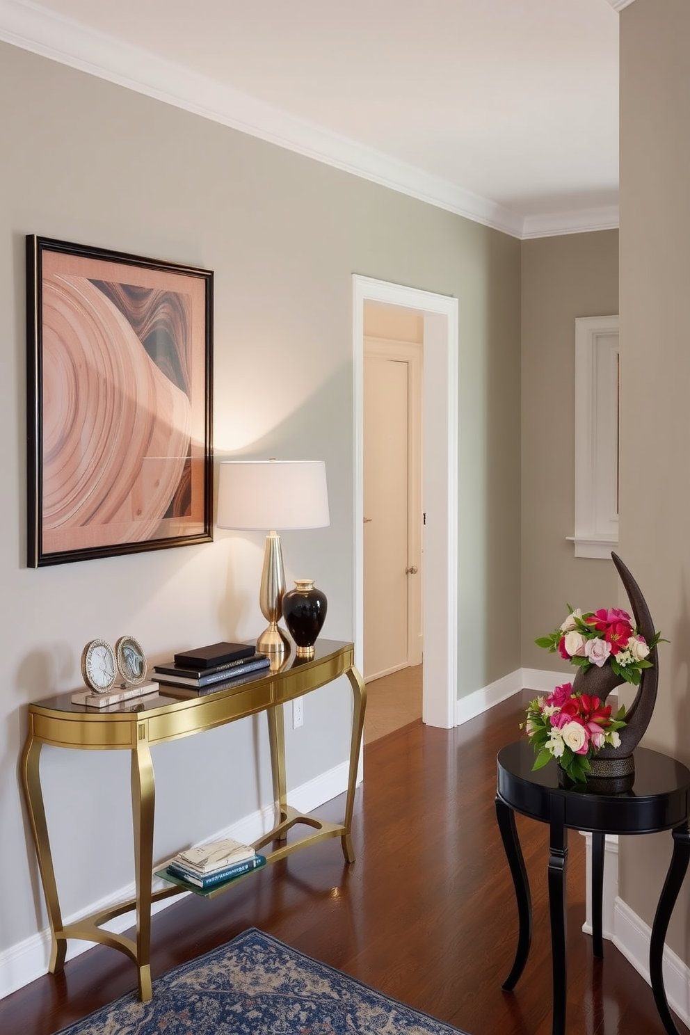 A long foyer features an elegant console table against the wall adorned with decorative items and a stylish lamp. A small side table is placed nearby, showcasing a unique sculpture and a fresh bouquet of flowers to enhance the decor.