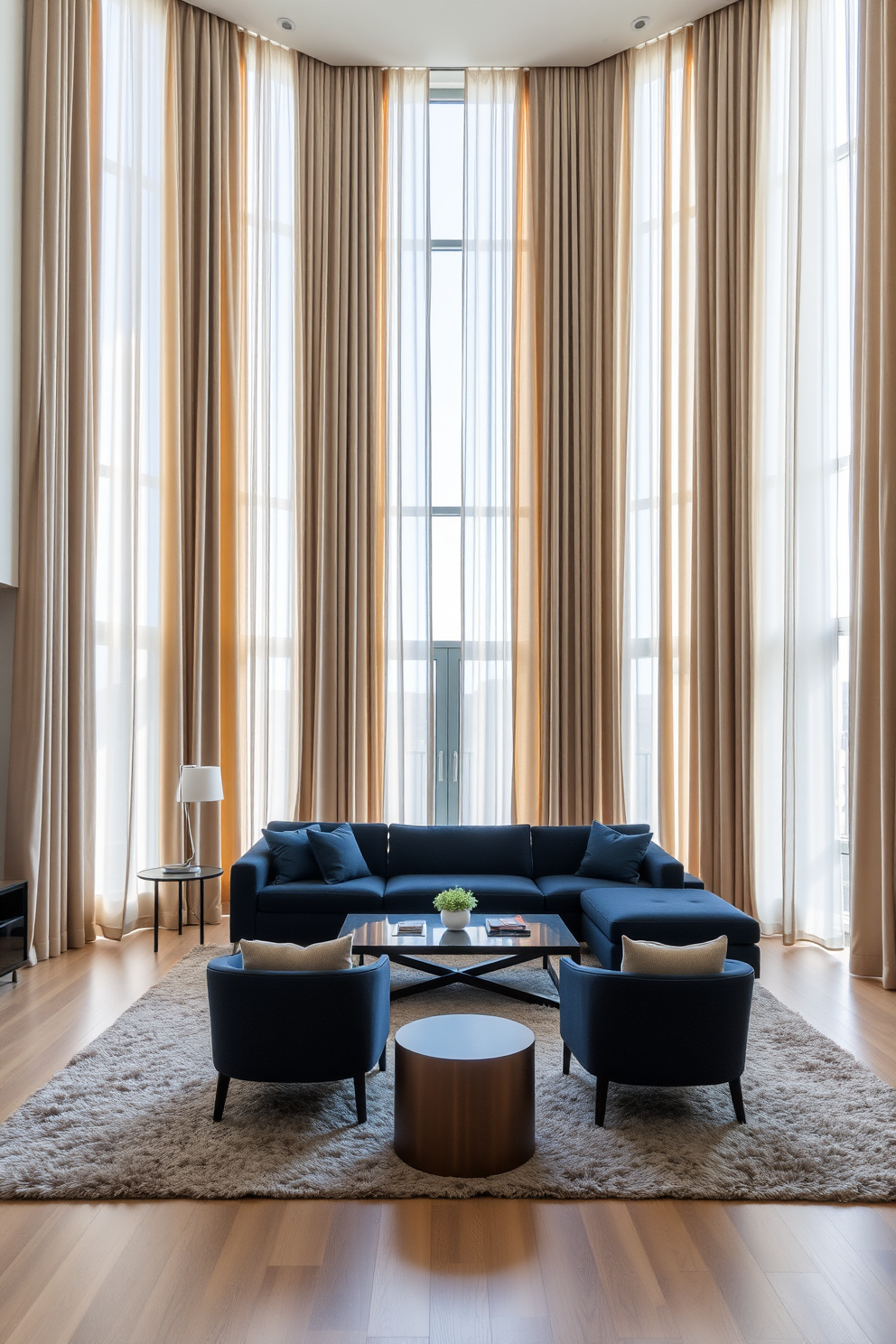 A spacious living room featuring floor-to-ceiling curtains that enhance the height of the room. The curtains are made of a soft, luxurious fabric in a neutral tone, allowing natural light to filter through while providing an elegant frame for the windows. In the center of the room, a large sectional sofa in a rich navy blue is complemented by a pair of modern accent chairs. A sleek coffee table sits atop a plush area rug, creating a cozy gathering space for family and friends.