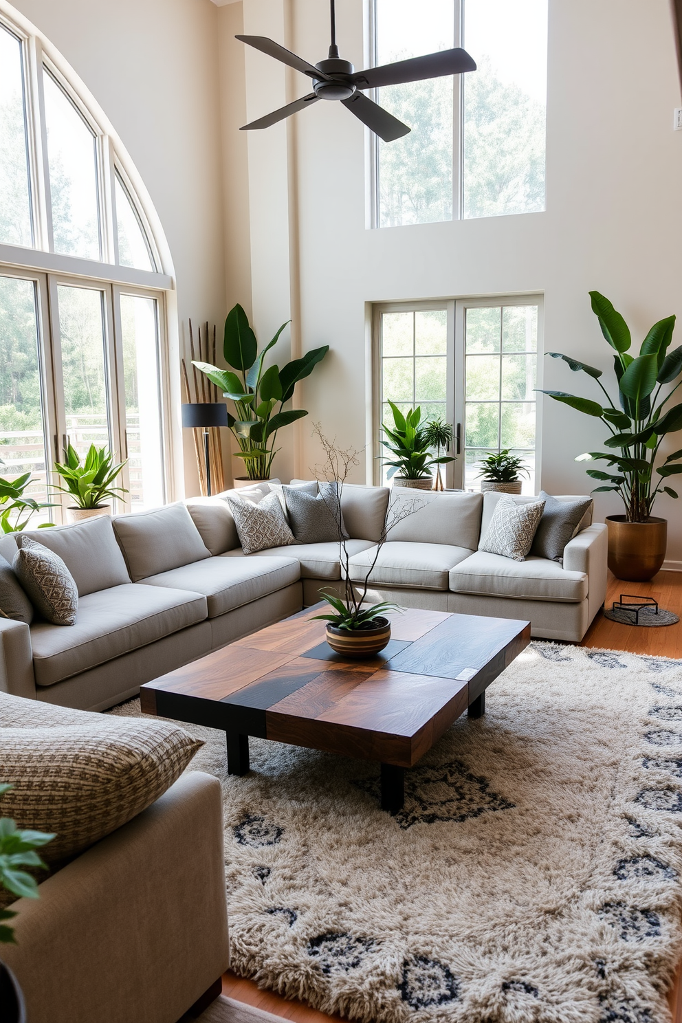 A luxurious family room featuring a large sectional sofa upholstered in soft gray fabric. The room is adorned with indoor plants in stylish pots, adding a touch of nature and vibrancy to the space. The focal point is a sleek coffee table made of reclaimed wood, surrounded by plush area rugs that enhance comfort. Large windows allow natural light to flood in, highlighting the elegant decor and creating a warm, inviting atmosphere.