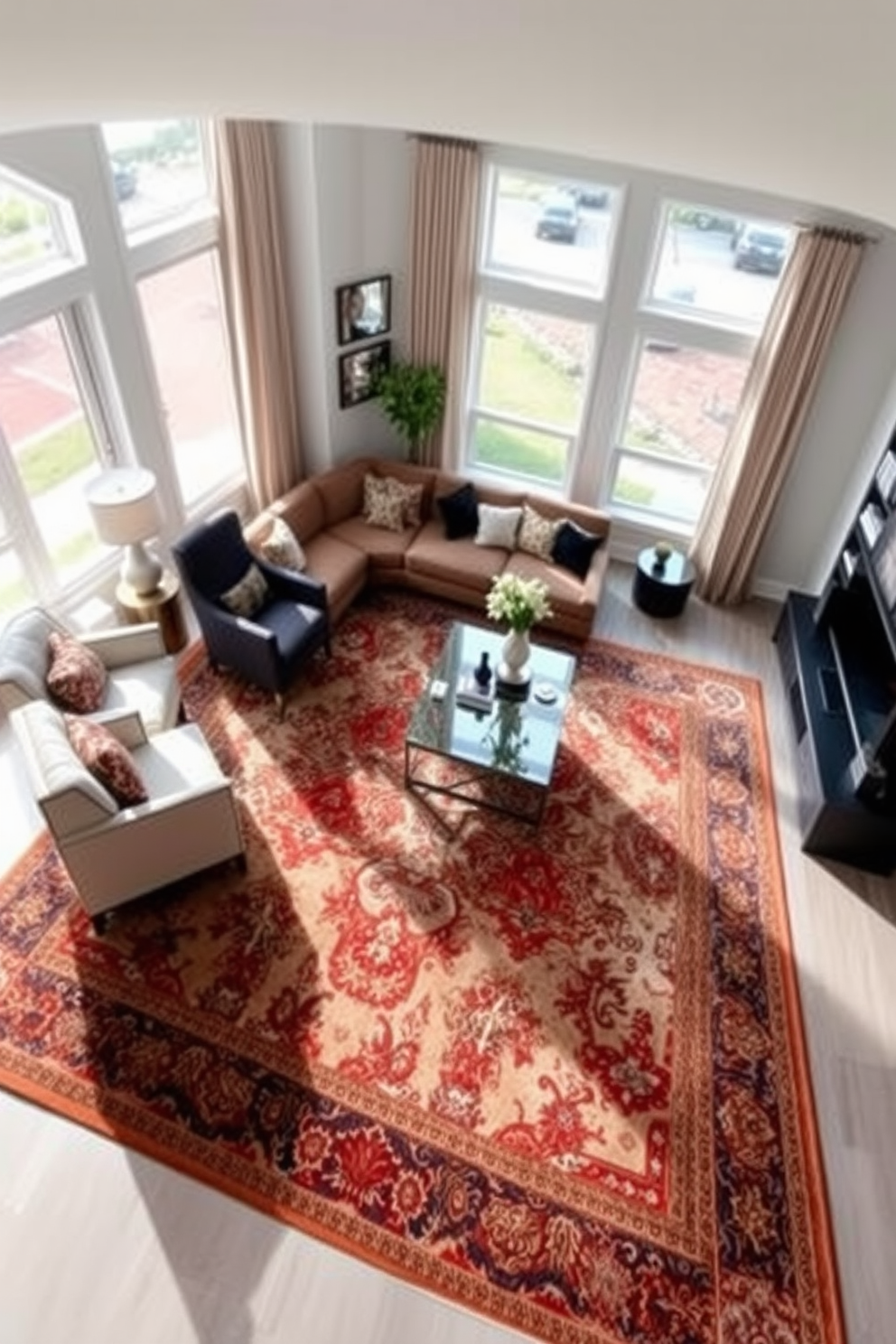 A spacious family room featuring a large area rug that anchors the seating arrangement. The rug is adorned with intricate patterns and rich colors, enhancing the overall warmth and comfort of the space. The room includes a plush sectional sofa and a pair of stylish armchairs, all arranged around a modern coffee table. Floor-to-ceiling windows allow natural light to flood the room, highlighting the elegant decor and inviting atmosphere.