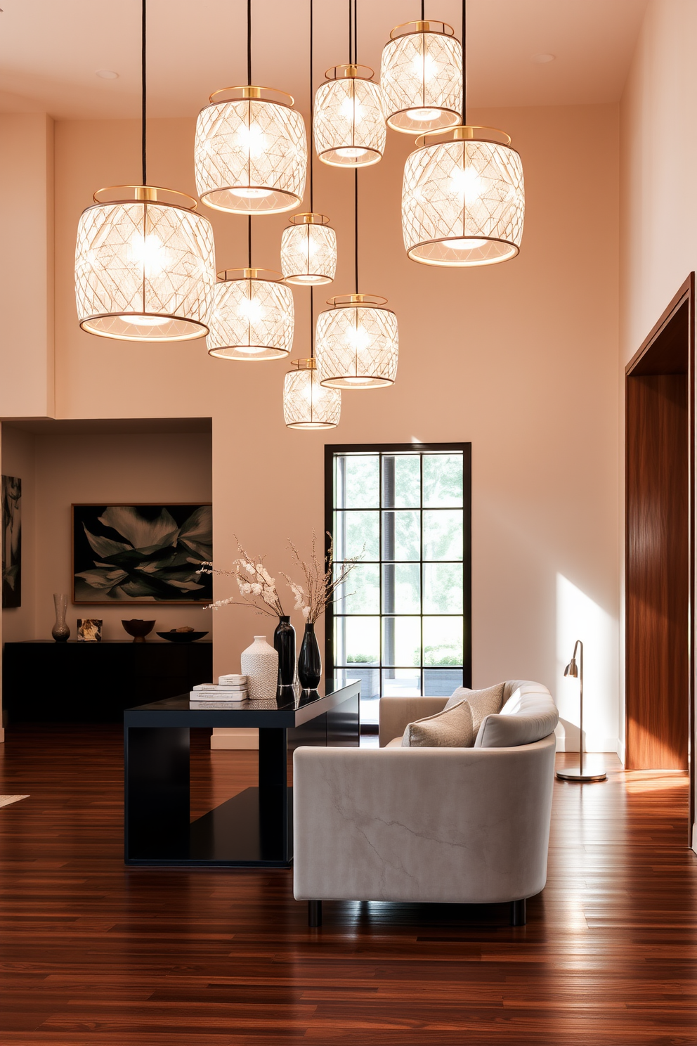 A striking foyer features unique pendant lights that create a warm and inviting atmosphere. The walls are adorned with elegant artwork, and the floor is covered in rich hardwood, enhancing the luxury feel of the space. The foyer includes a sleek console table topped with decorative objects and a large mirror that reflects the light from the pendant fixtures. Plush seating is arranged to create a cozy nook, inviting guests to linger and enjoy the sophisticated ambiance.