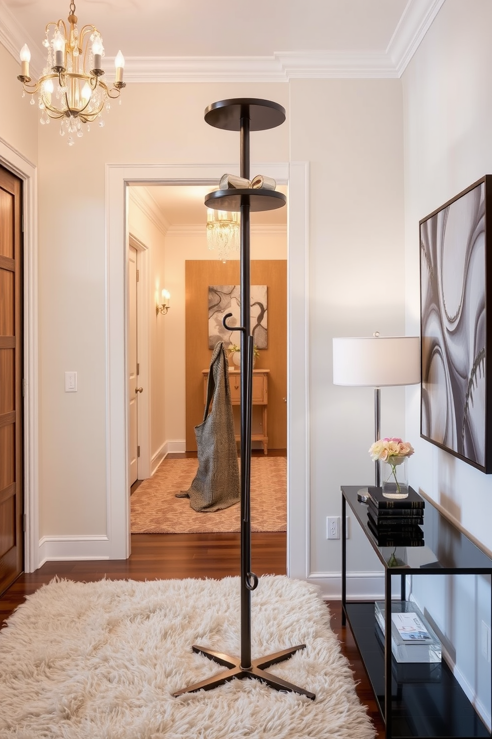 A stylish coat rack made of sleek metal with a minimalist design stands prominently in the foyer. The rack features multiple hooks at varying heights, complemented by a small shelf on top for decorative items. The foyer is adorned with elegant lighting fixtures that cast a warm glow throughout the space. A plush area rug adds texture underfoot, while a statement piece of art hangs on the wall, enhancing the luxurious ambiance.