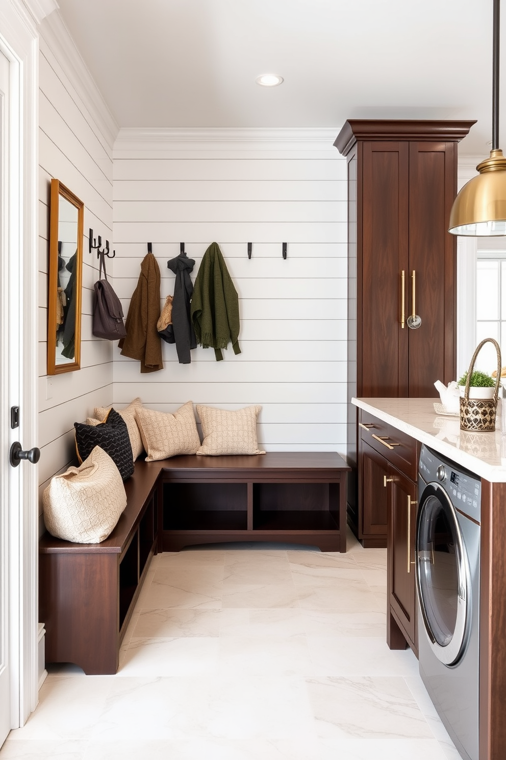 Accent wall with shiplap design. The wall features horizontal white shiplap boards creating a clean and modern look, complemented by a stylish bench with plush cushions below a row of hooks for coats and bags. Luxury mudroom design ideas. The space includes custom cabinetry for storage, a spacious island for folding laundry, and elegant tile flooring that adds a touch of sophistication while maintaining practicality.