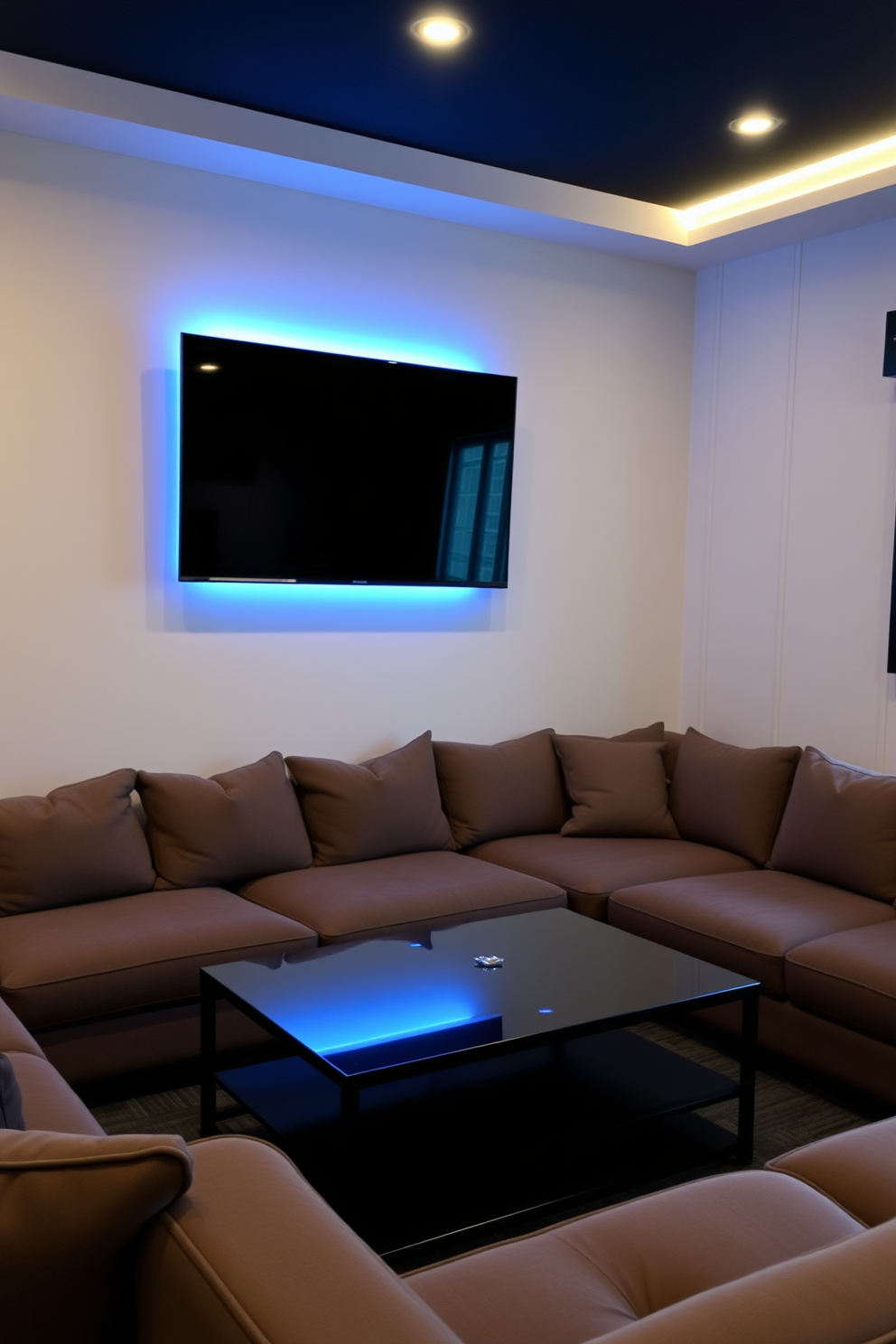 A stylish man cave featuring a wall-mounted flat screen for viewing pleasure. The space is furnished with a plush sectional sofa and a sleek coffee table, creating a comfortable atmosphere for relaxation and entertainment.