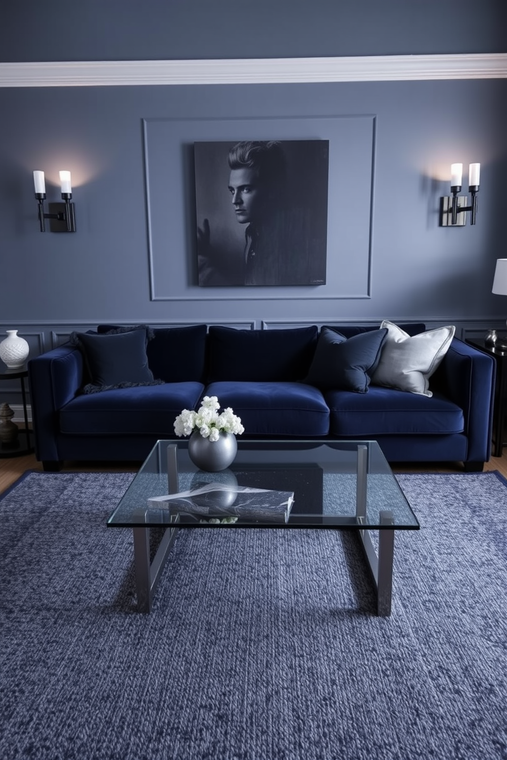 A stylish living room designed with a monochromatic color scheme featuring shades of deep blue. The space includes a plush navy sofa, a textured charcoal area rug, and a sleek glass coffee table, creating a cohesive and inviting atmosphere. Accent pillows in various fabrics add depth, while a statement artwork in a darker hue serves as a focal point. Soft lighting from modern sconces complements the rich textures, enhancing the overall masculine aesthetic of the room.