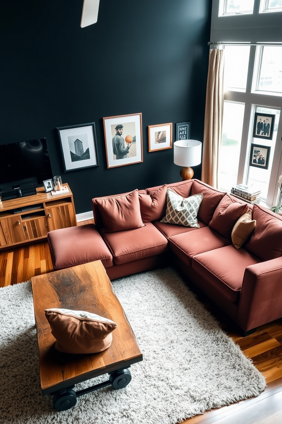 A cozy living room featuring a large sectional sofa adorned with oversized cushions in rich, earthy tones. The space is accented with a rustic wooden coffee table and a plush area rug that adds warmth to the hardwood floor. On one side, a sleek media console holds a flat-screen TV, surrounded by stylish decor and personal artifacts. The walls are painted in a deep charcoal color, creating a bold backdrop for framed artwork and photographs.