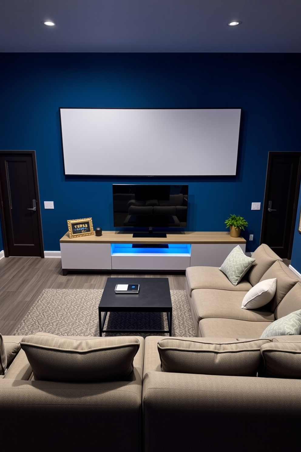 A modern media game room featuring a sleek console gaming station adjacent to a powerful PC gaming setup. The room is equipped with comfortable gaming chairs, ambient LED lighting, and a large screen for immersive gameplay experiences. The walls are adorned with gaming-themed artwork and shelves displaying collectibles. A plush area rug adds warmth to the space, while soundproofing panels ensure an optimal audio environment for gaming sessions.