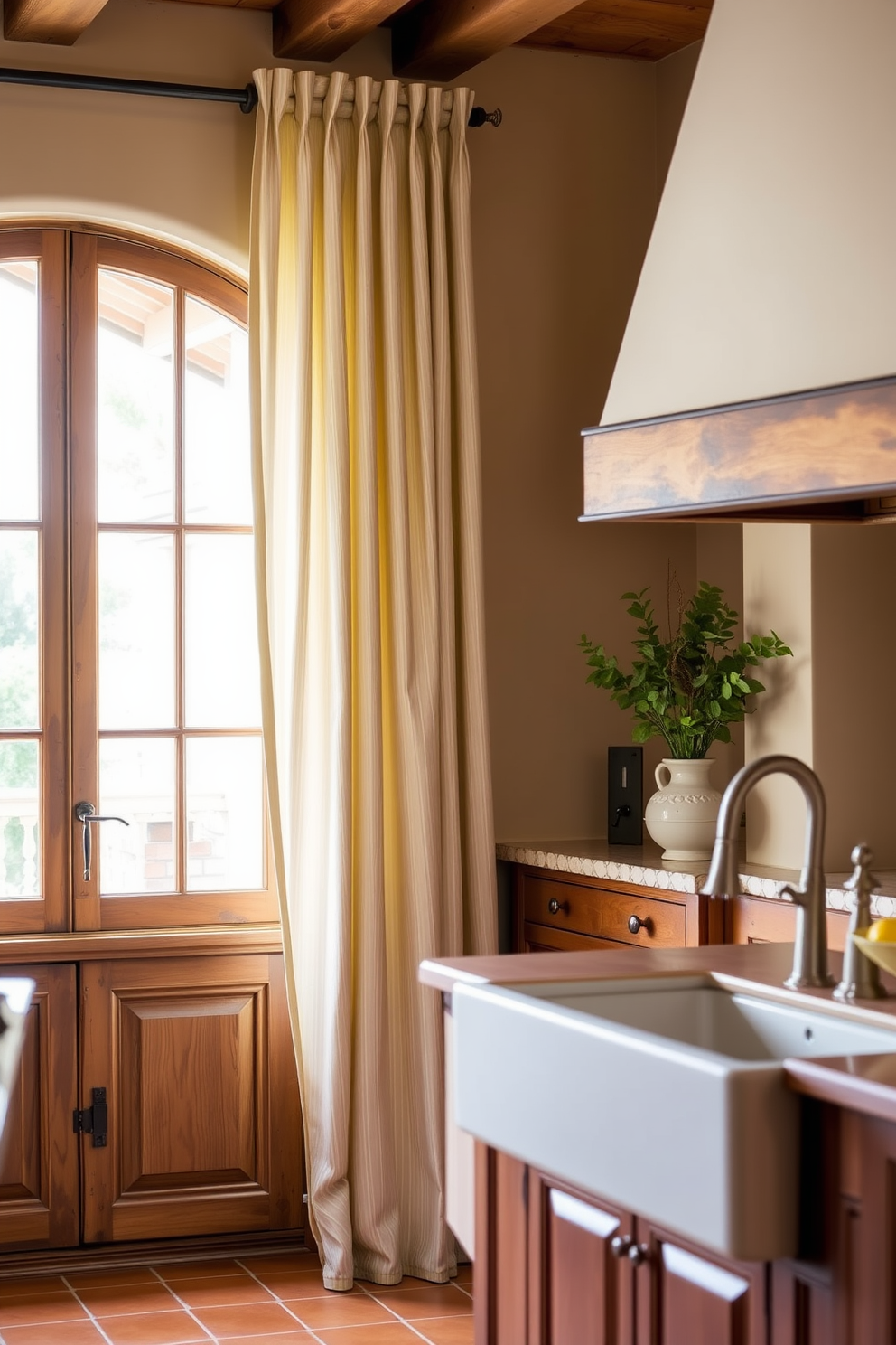 Elegant drapery for soft window treatments. The curtains are made of light, flowing fabric with a subtle pattern that complements the room's color palette. Mediterranean kitchen design ideas. The space features rustic wooden cabinets, a large farmhouse sink, and terracotta tiles that add warmth and charm.