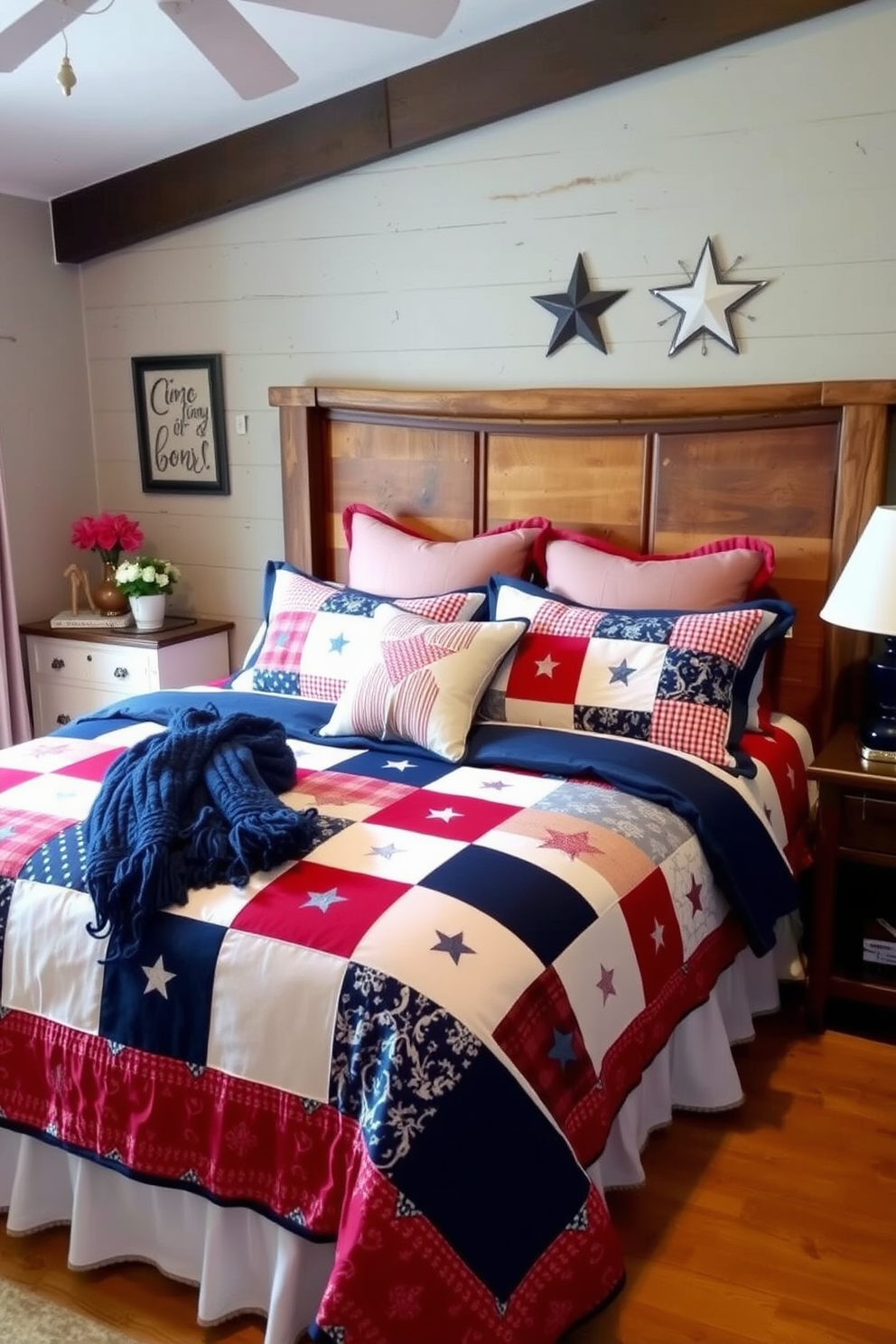 A cozy bedroom featuring a red white and blue bedding set that evokes a festive Memorial Day atmosphere. The bed is adorned with a patchwork quilt and matching pillows, complemented by a rustic wooden headboard and subtle patriotic decorations on the walls.