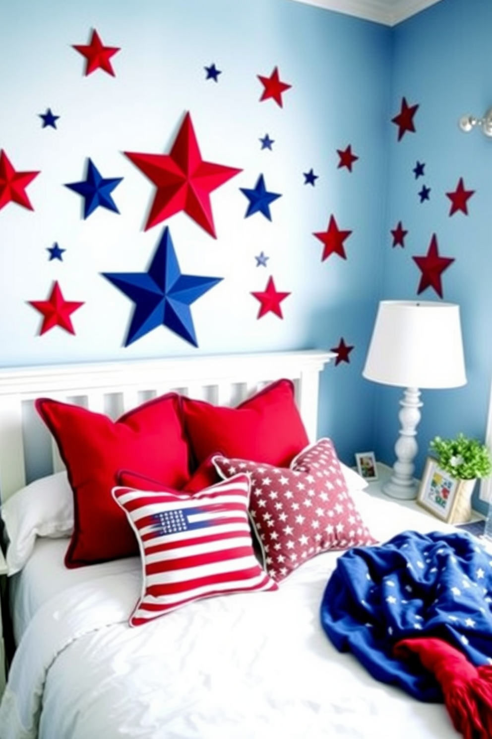 A cozy bedroom decorated for Memorial Day featuring wall decals of stars and stripes. The room is painted in soft blue tones with white bedding and red accent pillows, creating a patriotic atmosphere.