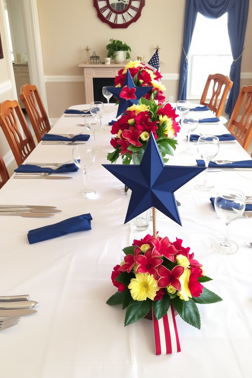 A beautifully set dining table features star-shaped centerpieces adorned with vibrant flowers. The table is dressed in a crisp white tablecloth with navy blue accents, creating a festive atmosphere for Memorial Day celebrations.