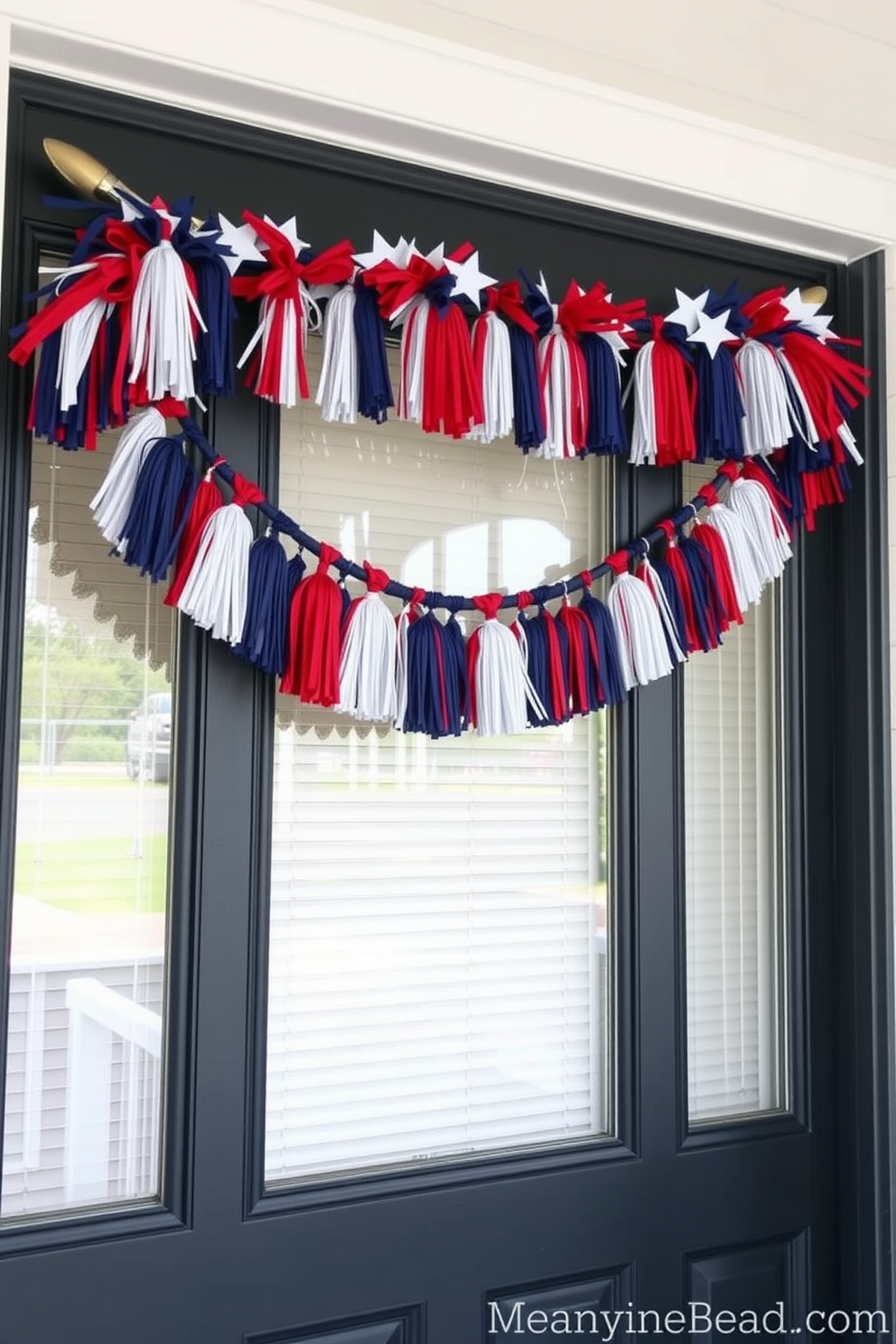 A festive front door adorned with a hanging garland featuring red, white, and blue tassels. The garland drapes elegantly across the top of the door, creating a cheerful and patriotic welcome for Memorial Day.