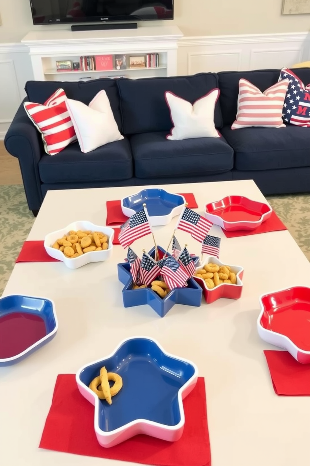 Festive tableware for snacks. The table is adorned with vibrant red, white, and blue plates and napkins, complemented by star-shaped serving dishes filled with an assortment of snacks. Memorial Day Game Room Decorating Ideas. The game room features a large sectional sofa in navy blue, paired with red and white throw pillows, and a coffee table decorated with themed coasters and a centerpiece of miniature American flags.