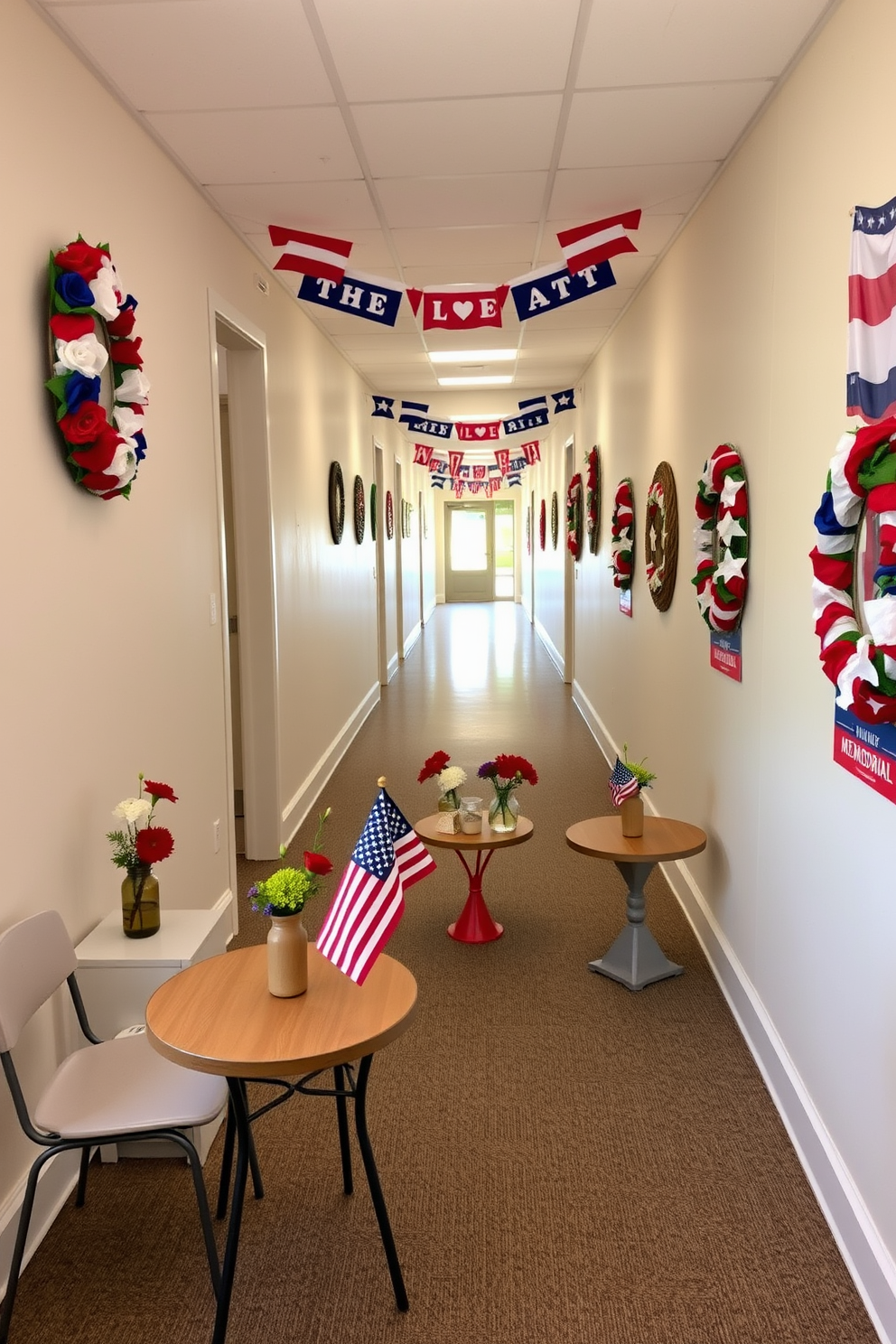 Small tables adorned with vibrant red white and blue themed centerpieces create a festive atmosphere. Each table features a small American flag alongside seasonal flowers in a rustic vase. The hallway is lined with decorative elements that evoke the spirit of Memorial Day. Wreaths made of artificial flowers and stars hang on the walls while themed banners add to the celebratory decor.