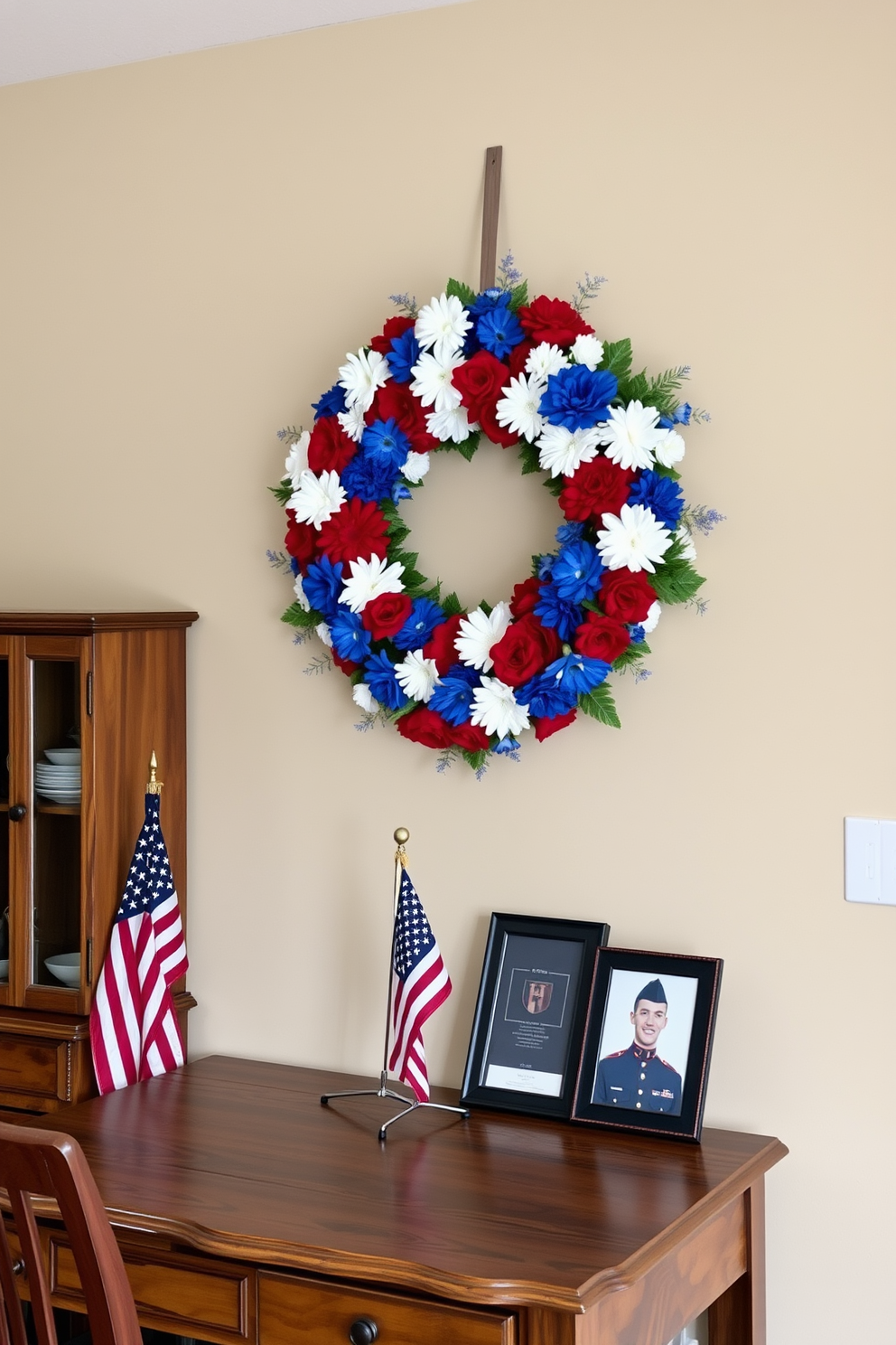 A vibrant wreath made of red, white, and blue flowers is hung on the wall, symbolizing patriotism and remembrance. The home office features a rustic wooden desk adorned with a small American flag and a framed photo of a loved one in uniform.