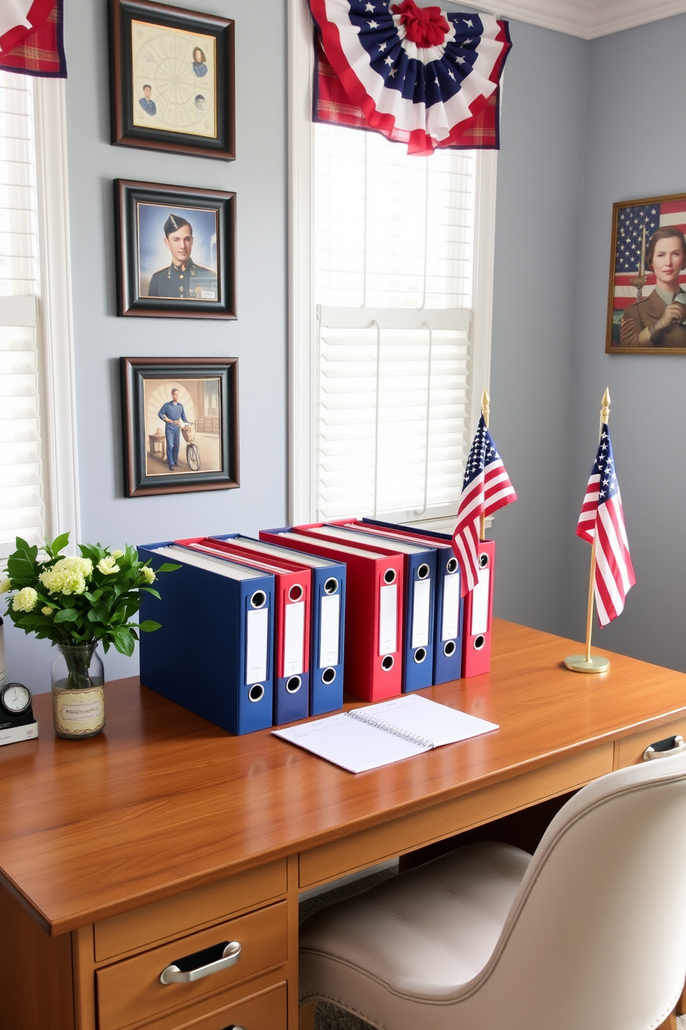 A home office decorated for Memorial Day features file organizers in red, white, and blue arranged neatly on a wooden desk. The walls are adorned with patriotic artwork and a small American flag sits proudly on the corner of the desk.