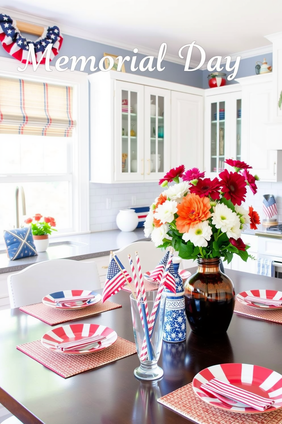 A decorative cake stand is placed at the center of a beautifully arranged kitchen island. The stand is adorned with small flags representing Memorial Day, adding a festive touch to the overall decor. Surrounding the cake stand are fresh flowers in vibrant colors, enhancing the cheerful atmosphere. The kitchen features a light color palette with white cabinetry and a rustic wooden countertop, creating a warm and inviting space.