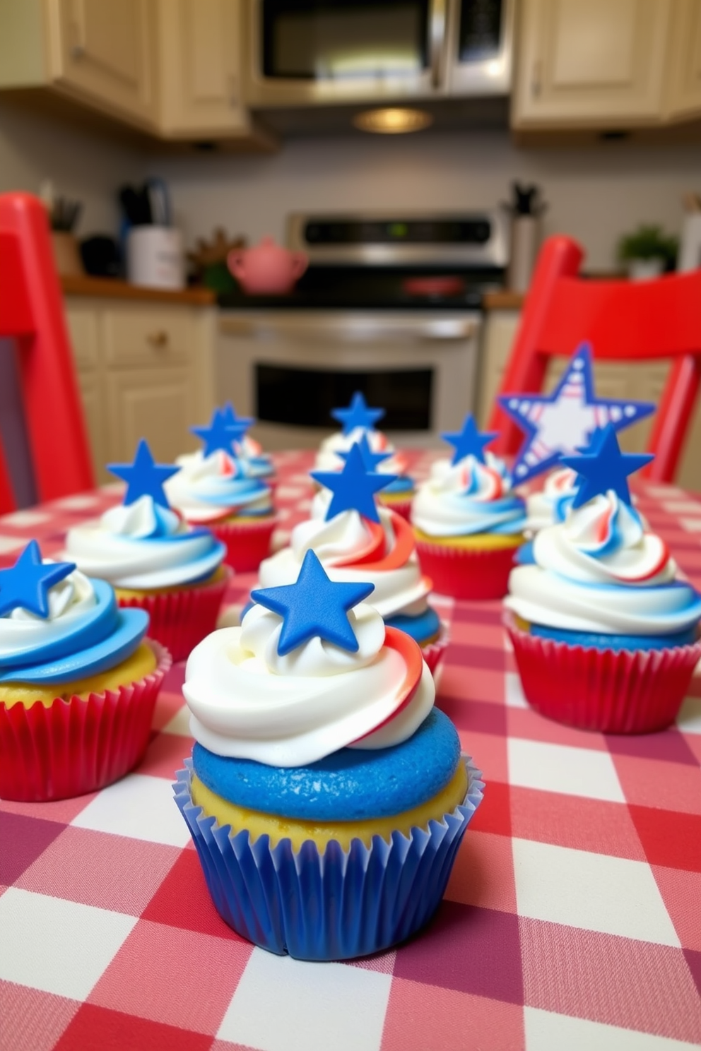 Mini red white and blue cupcakes are beautifully arranged on a festive kitchen table. The table is adorned with a vibrant checkered tablecloth and decorative stars and stripes accents for a patriotic touch.