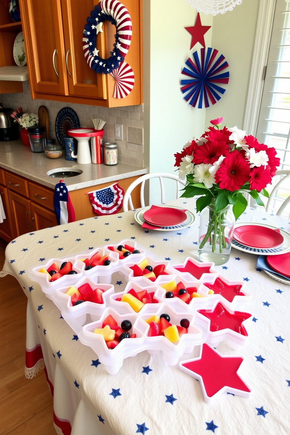 A festive kitchen setting for Memorial Day. The countertop is adorned with star shaped ice trays filled with colorful frozen fruit, ready for refreshing drinks. Red, white, and blue decorations are tastefully arranged throughout the space. A patriotic tablecloth covers the dining table, complemented by matching dishware and vibrant flowers in a vase.