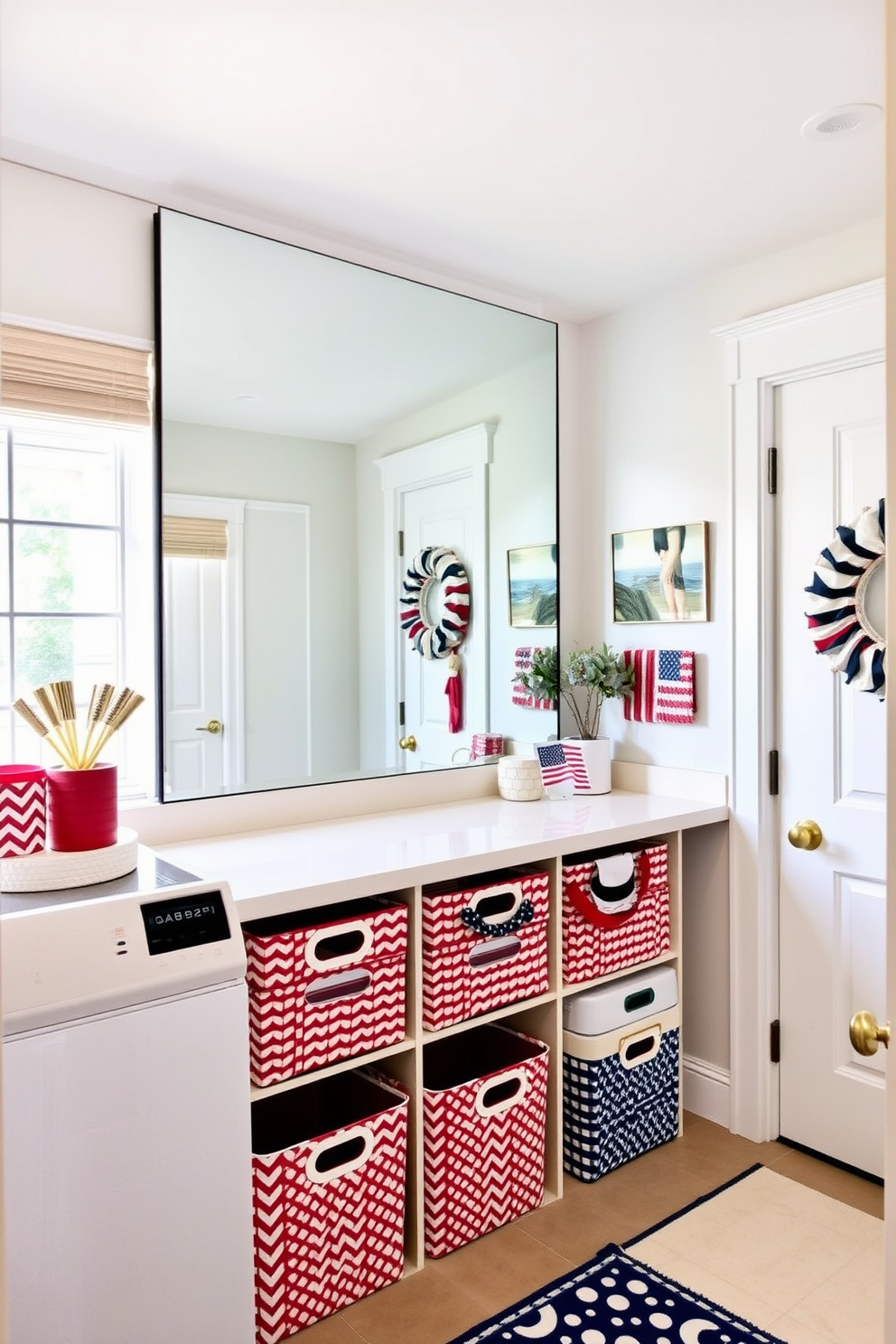 A spacious laundry room features a large mirror on the wall opposite the window, designed to reflect natural light and create an airy atmosphere. The decor incorporates Memorial Day elements, with red, white, and blue accents throughout the space, including patterned storage bins and a festive wreath on the door.