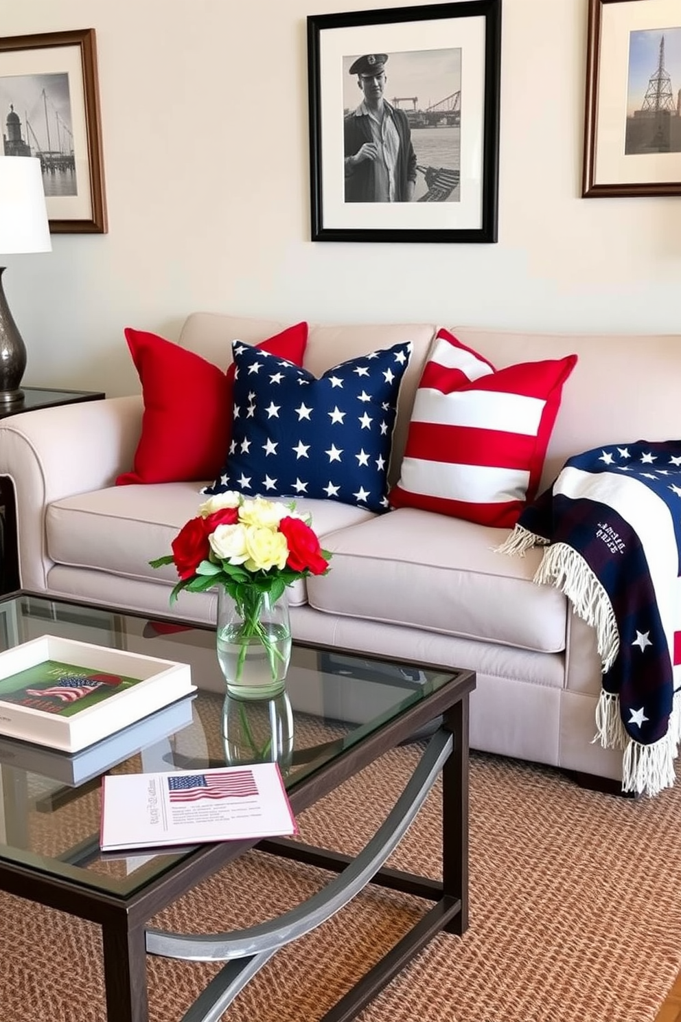 Create a cozy living room setting that celebrates Memorial Day. Incorporate red white and blue throw pillows on a neutral sofa, complemented by a patriotic-themed blanket draped over the armrest. Include a coffee table adorned with a small vase of fresh flowers in similar colors. The walls should be decorated with framed artwork that reflects the spirit of the holiday, enhancing the festive atmosphere.