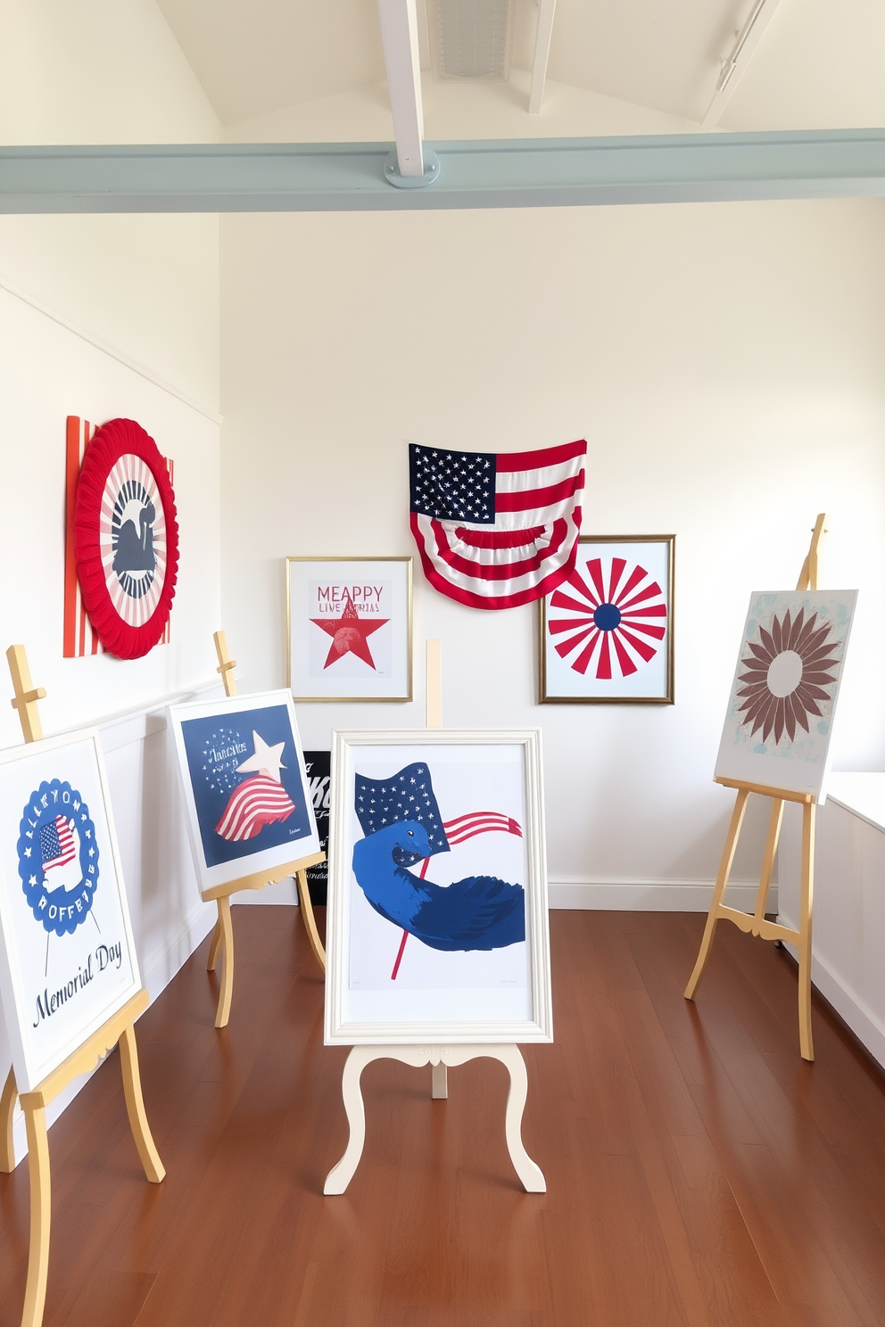 A vibrant loft space adorned with patriotic-themed artwork displayed on elegant easels. The walls are painted in a soft white, creating a bright backdrop for the red, white, and blue pieces that celebrate Memorial Day.