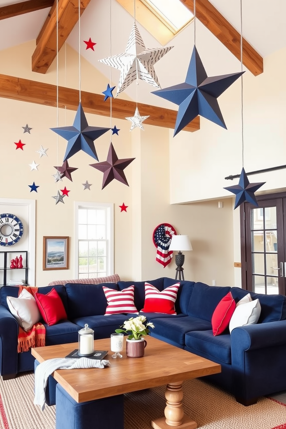 Create a cozy loft space decorated for Memorial Day. The room features hanging stars and stripes mobiles from the ceiling, adding a festive touch to the ambiance. The walls are painted in a soft cream color, complemented by rustic wooden beams. A large sectional sofa in navy blue is adorned with red and white throw pillows, creating a patriotic yet inviting atmosphere.