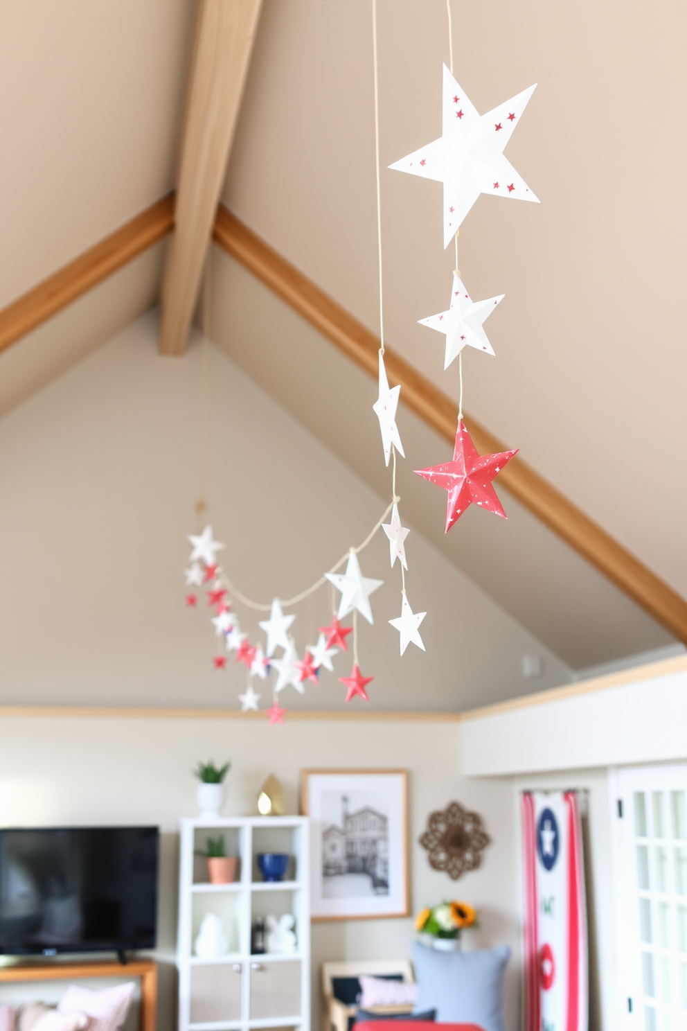 A cozy loft space adorned with a DIY star garland hanging gracefully from the ceiling. The stars are made from recycled materials and add a festive touch to the room’s patriotic decor for Memorial Day.