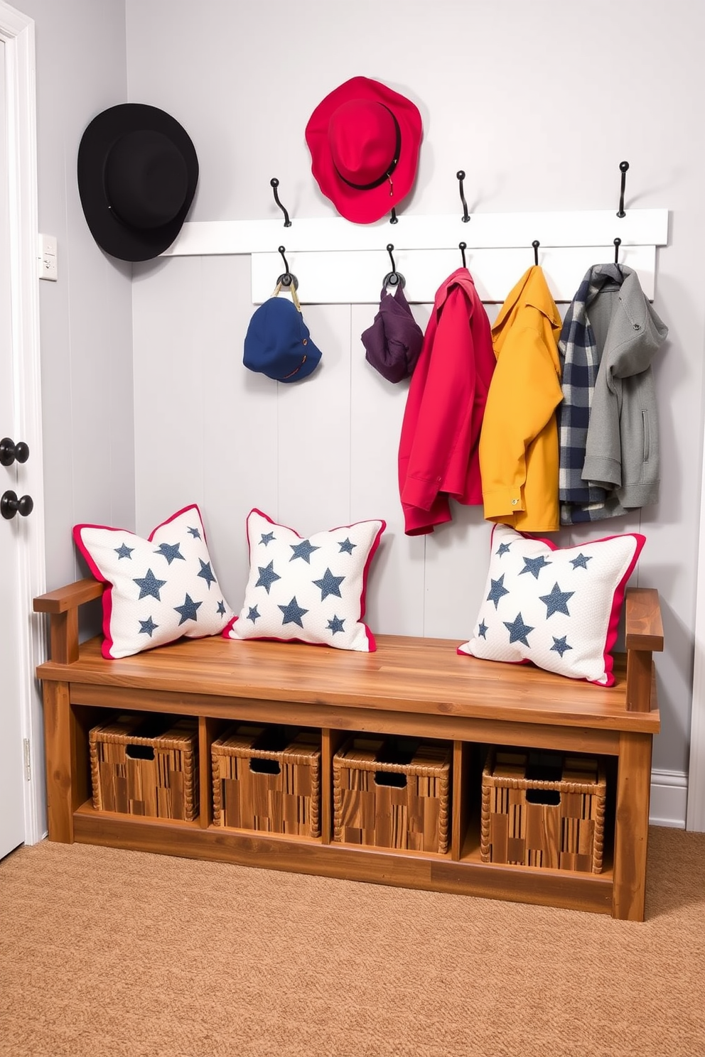 A cozy mudroom features a bench with a rustic wooden base and soft cushions adorned with star patterns. The walls are painted in a light gray tone, and decorative hooks hold colorful jackets and hats, creating a welcoming space for family and friends.