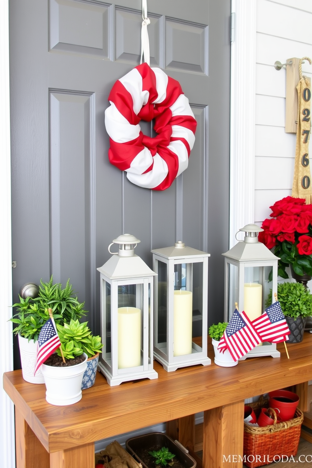 Decorative lanterns with candles create a warm and inviting atmosphere in the mudroom. The lanterns are placed on a rustic wooden bench, surrounded by potted plants and seasonal decor. For Memorial Day, the mudroom is adorned with red, white, and blue accents. A festive wreath hangs on the door, while small flags are placed beside the lanterns to enhance the patriotic theme.