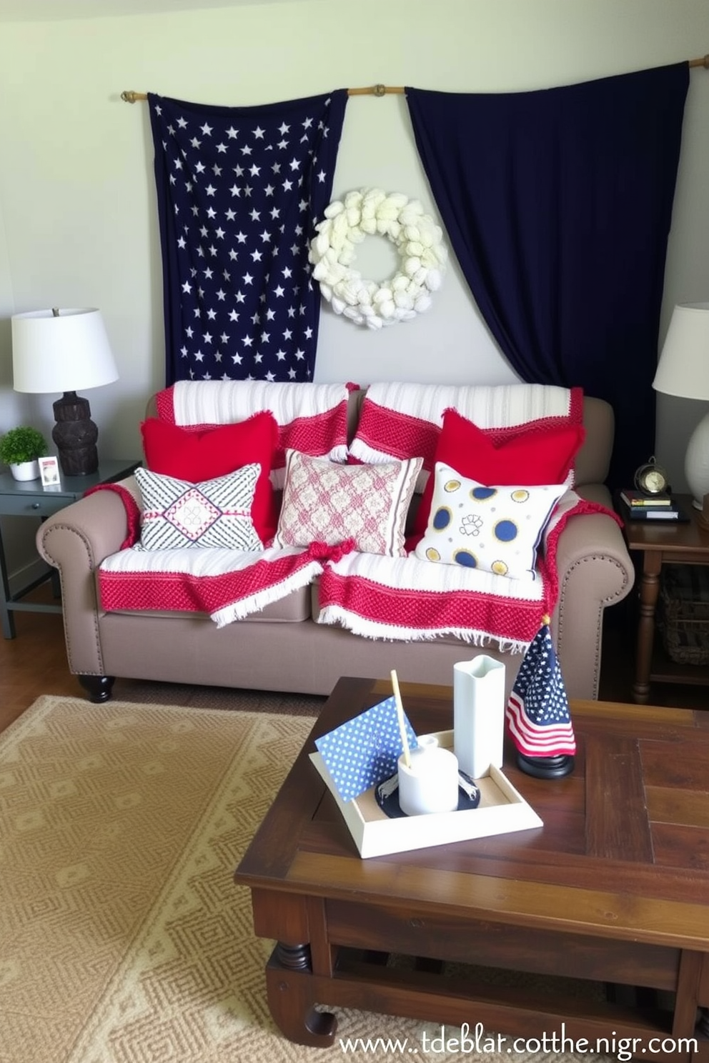 A cozy small living room decorated for Memorial Day features red white and blue patterned blankets draped over a comfortable sofa. Accent pillows in complementary colors add a festive touch while a rustic coffee table holds a few decorative items celebrating the holiday.