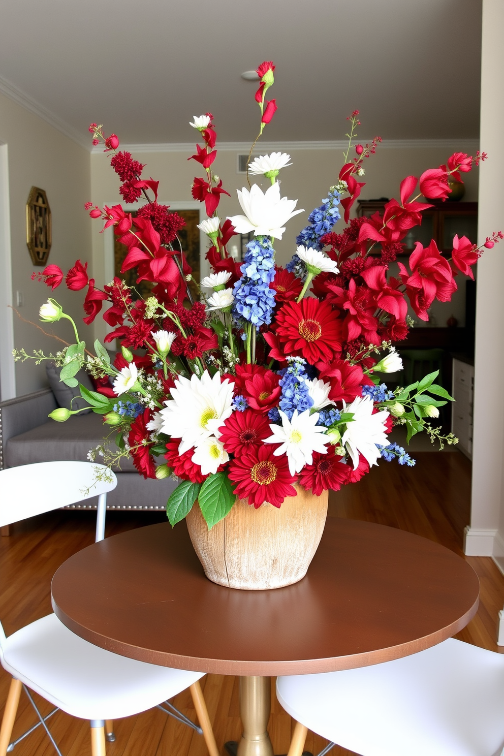 A vibrant seasonal centerpiece featuring an array of fresh flowers in red white and blue hues. The arrangement is placed in a rustic wooden bowl on a small dining table surrounded by minimalist chairs. Creative small space decorating ideas that incorporate multifunctional furniture and clever storage solutions. A compact sofa bed paired with a stylish coffee table that doubles as a storage unit enhances the room's functionality while maintaining a chic aesthetic.