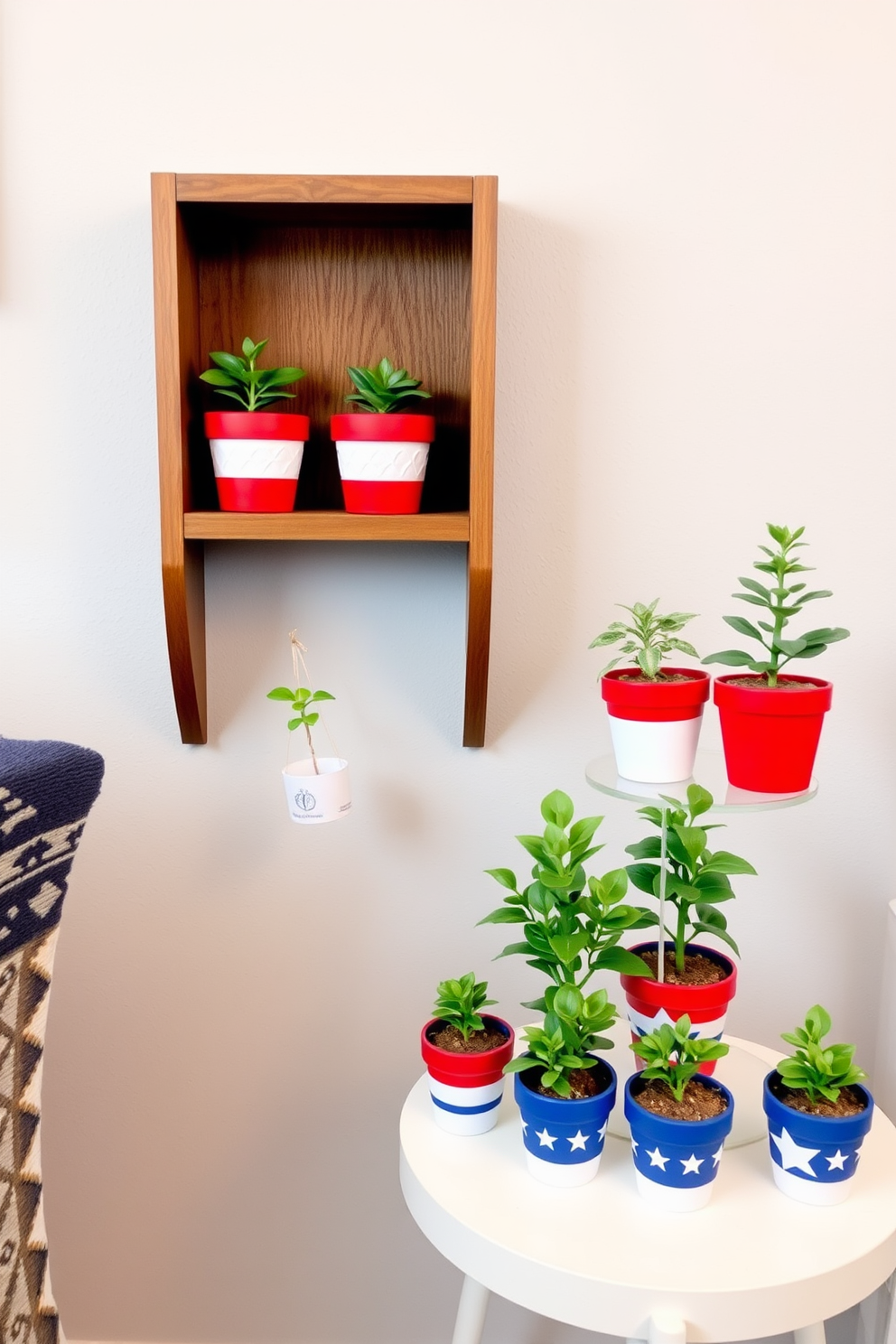 Mini potted plants in red white and blue pots are arranged on a small wooden shelf. The shelf is positioned against a light gray wall, adding a festive touch to the compact space. A small round table features additional mini plants in similar pots, creating a cohesive look. This arrangement brings a vibrant yet subtle celebration of Memorial Day into the room.