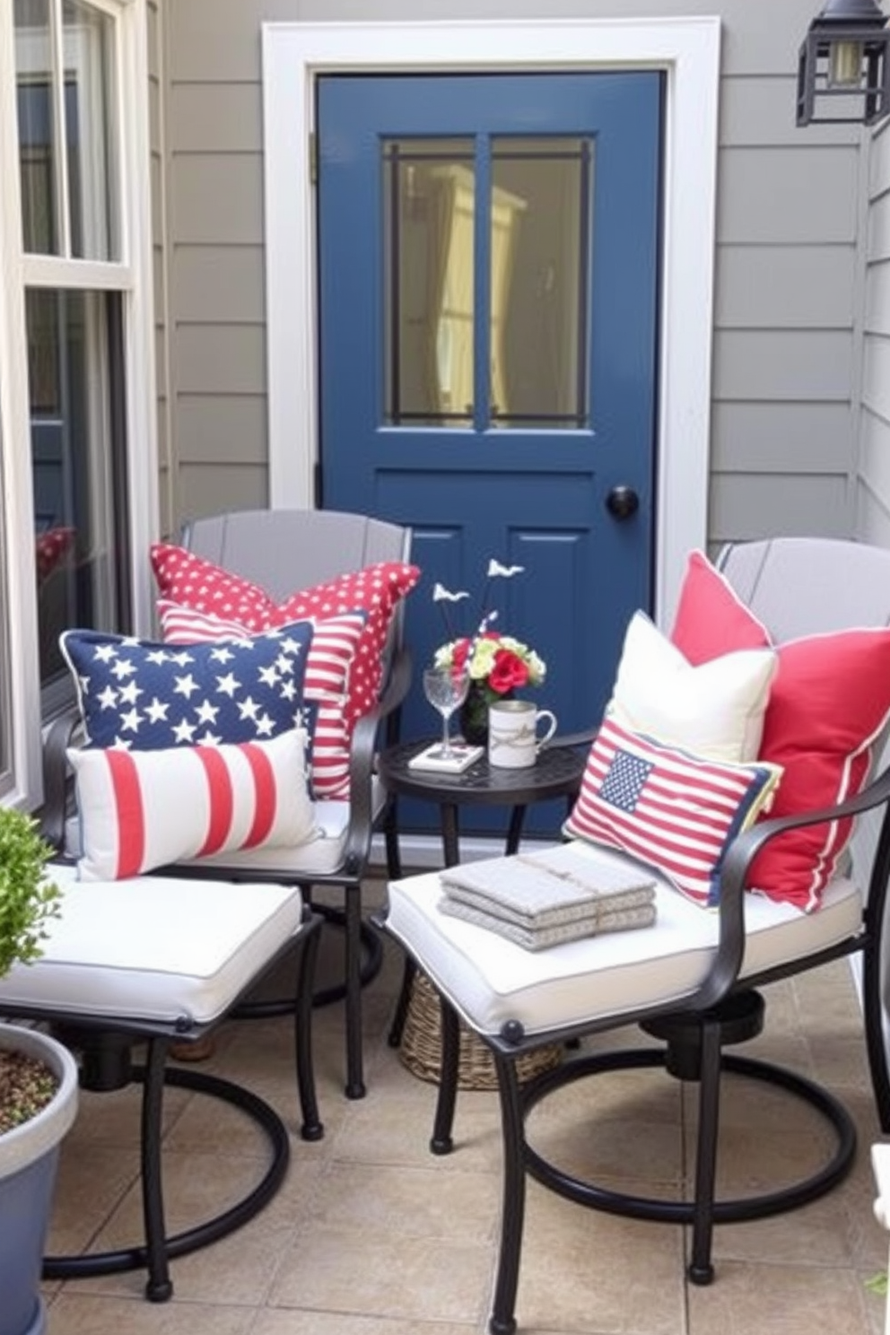 Seasonal cushions in vibrant colors are arranged on a set of stylish outdoor chairs, creating a festive atmosphere for Memorial Day gatherings. The cushions feature patriotic patterns, adding a touch of celebration to the cozy outdoor space. In a compact patio area, the outdoor chairs are positioned around a small table, perfect for intimate gatherings. Cleverly chosen accessories enhance the small space, making it feel inviting and stylish while maintaining functionality.