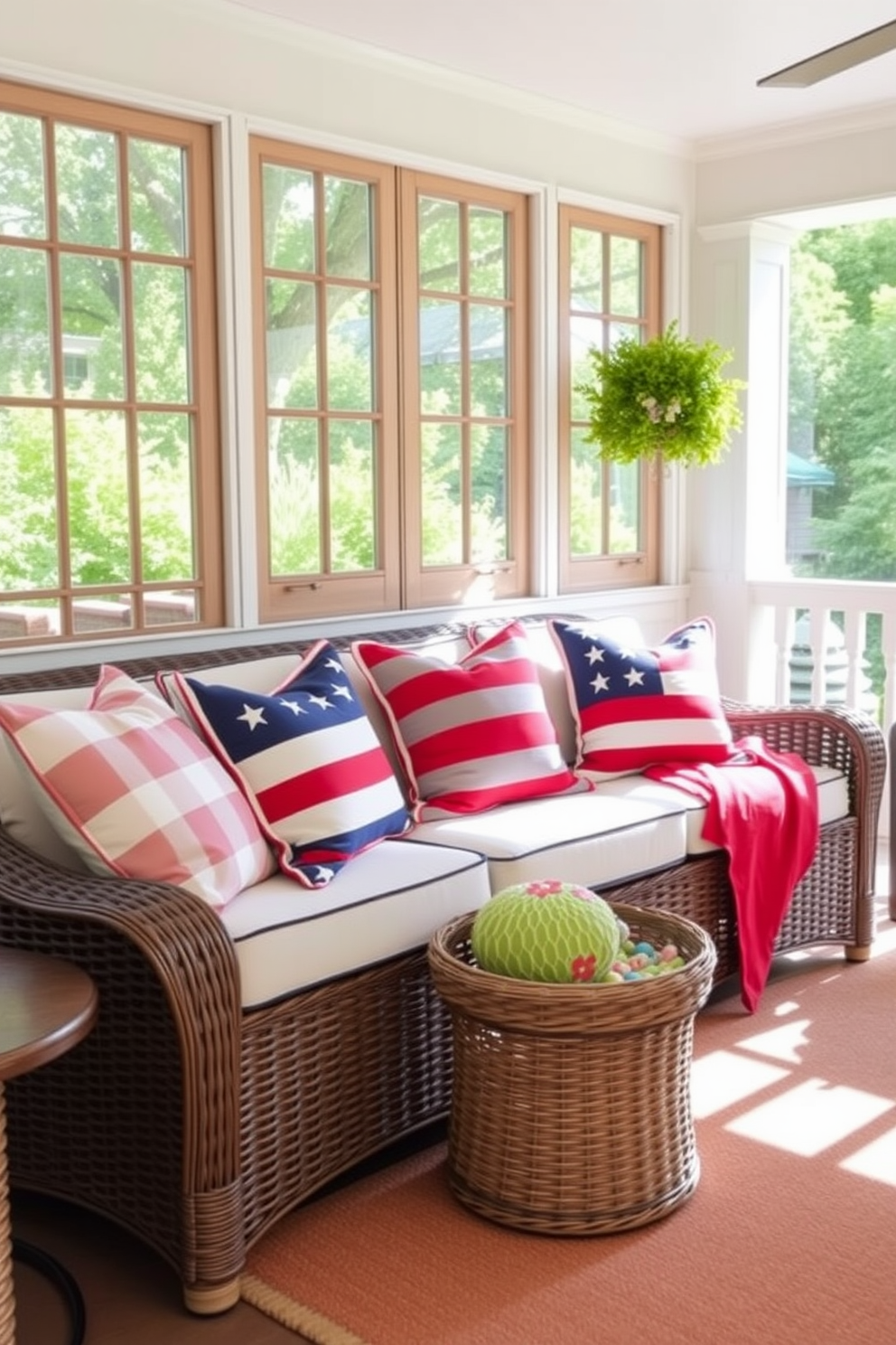 A cozy sunroom adorned with an outdoor rug featuring vibrant patriotic colors. The rug complements the space, which is filled with comfortable seating and potted plants, creating a welcoming atmosphere for Memorial Day gatherings.