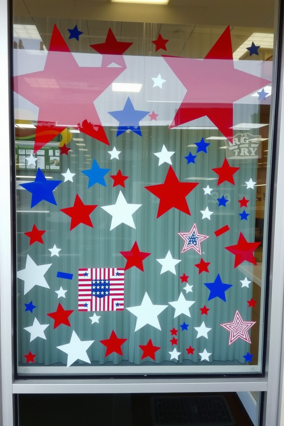 A festive window display featuring stars and stripes window clings that celebrate Memorial Day. The window is adorned with a mix of large and small clings in red, white, and blue, creating a vibrant patriotic theme.