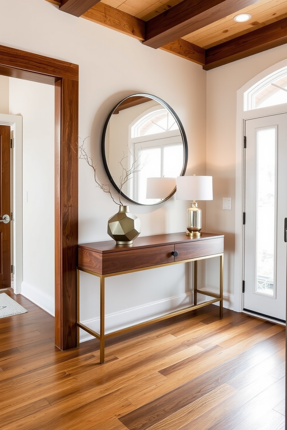 A Mid Century Modern foyer features a striking blend of metals that create an eclectic vibe. The space showcases a sleek console table with a brass finish paired with a geometric pendant light in matte black. Bold artwork adorns the walls, while a vintage mirror with an antiqued silver frame reflects the natural light. A plush area rug with warm tones ties together the wooden flooring and adds a cozy touch to the entrance.