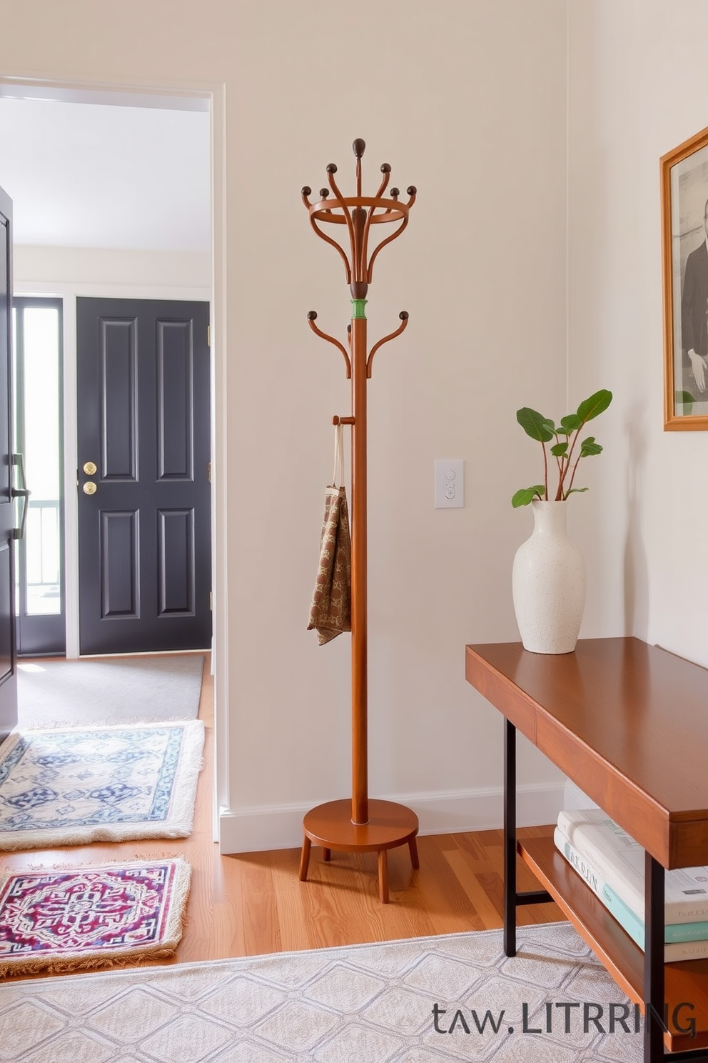 A mid century mirror hangs elegantly in the foyer, reflecting the warm natural light streaming through a nearby window. The walls are adorned with soft neutral tones, creating a welcoming atmosphere that complements the sleek lines of mid century modern furniture.