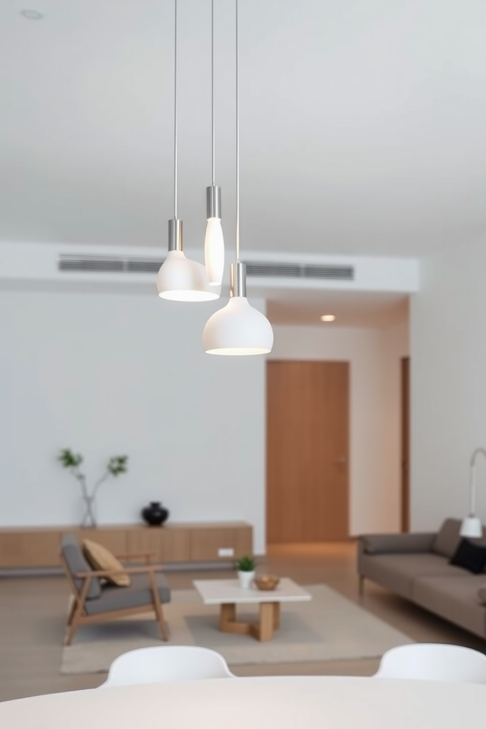 Minimalist lighting fixtures for elegance. Sleek pendant lights hang from the ceiling, casting a soft glow over the room. Minimalist apartment design ideas. Open spaces are adorned with neutral colors and simple furniture, creating a serene and uncluttered atmosphere.