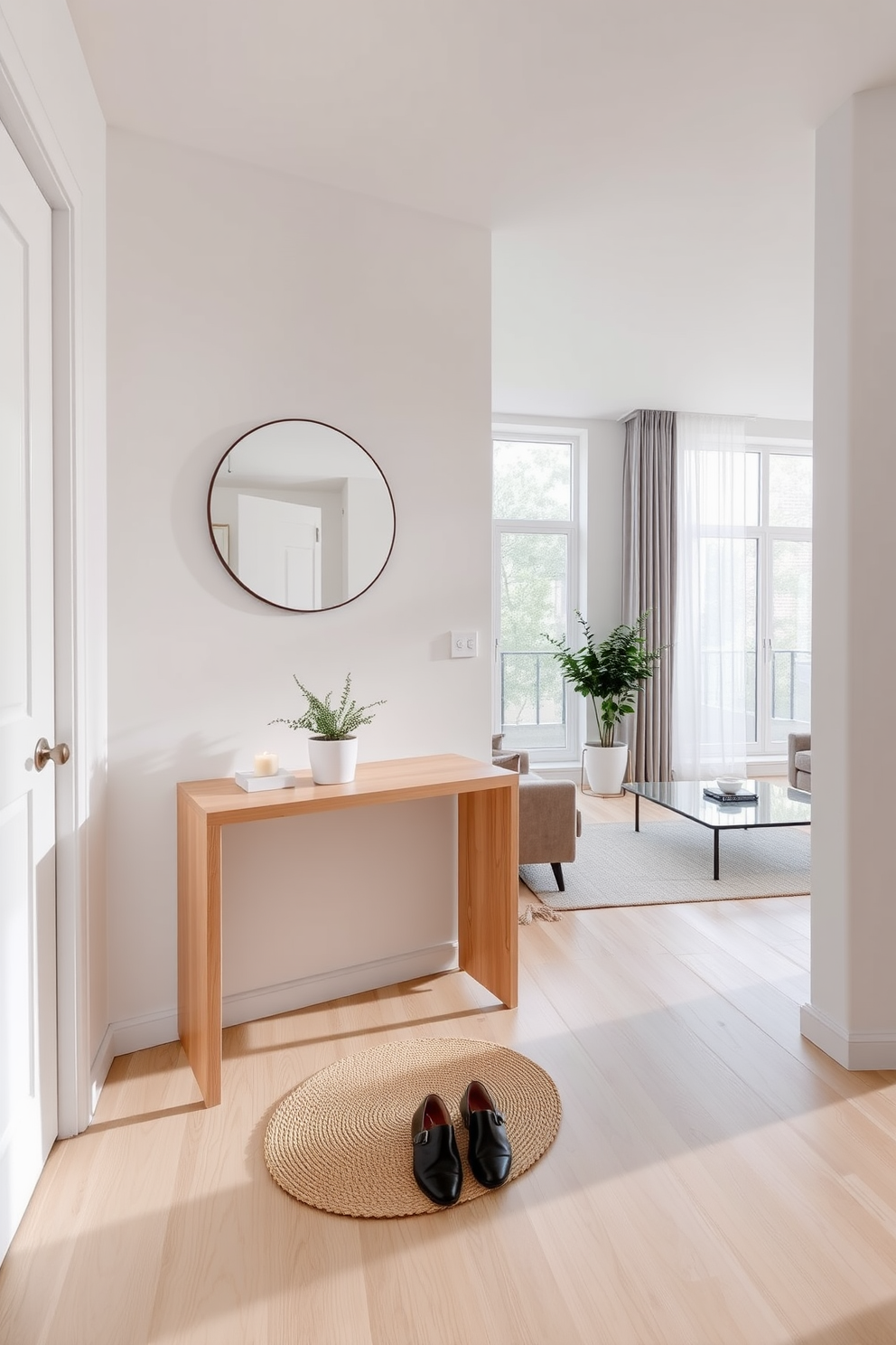 A functional entryway with minimal clutter features a sleek console table made of light wood, accompanied by a simple round mirror above it. A small potted plant sits on the table, while a pair of stylish shoes is neatly arranged on a woven mat below. Minimalist apartment design ideas showcase an open-plan living space with a neutral color palette and streamlined furniture. Large windows allow natural light to flood the room, highlighting a cozy seating area with a low-profile sofa and a glass coffee table.