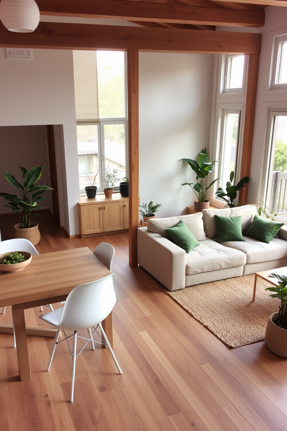 A minimalist apartment design featuring an open-concept living space with a sleek gray sofa and a glass coffee table. The walls are painted in a soft white hue, and a single large abstract artwork in muted tones hangs above the sofa. The kitchen area boasts a simple wooden island with high stools, and stainless steel appliances complement the modern aesthetic. A potted green plant sits on the island, adding a touch of nature to the streamlined design.