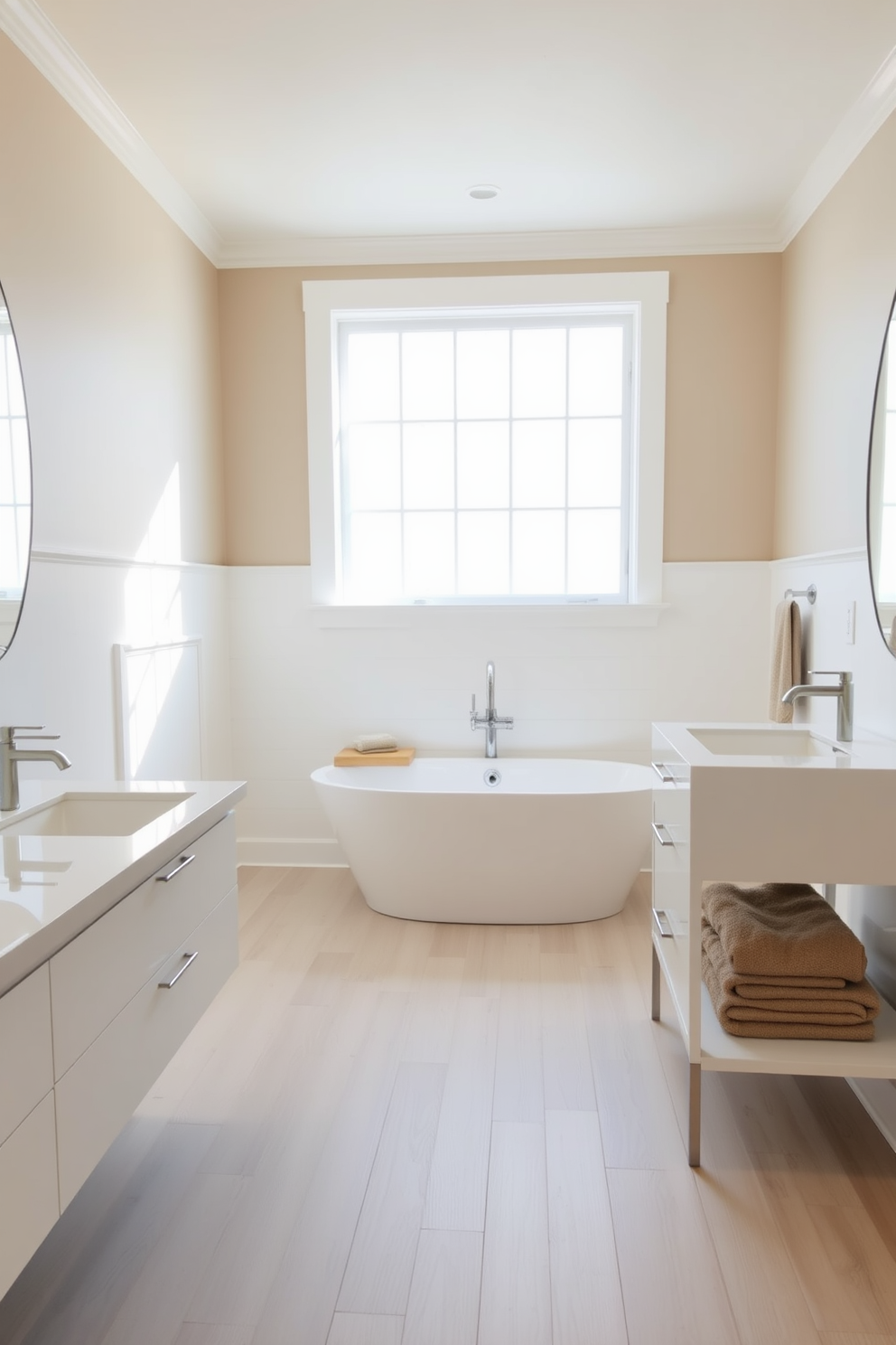 A serene bathroom space features minimalist fixtures with clean lines. The walls are painted in a soft white hue, and the floor is adorned with light gray tiles. A sleek freestanding bathtub sits in the center, complemented by a simple chrome faucet. Above, a large frameless mirror reflects the natural light streaming in from a nearby window.